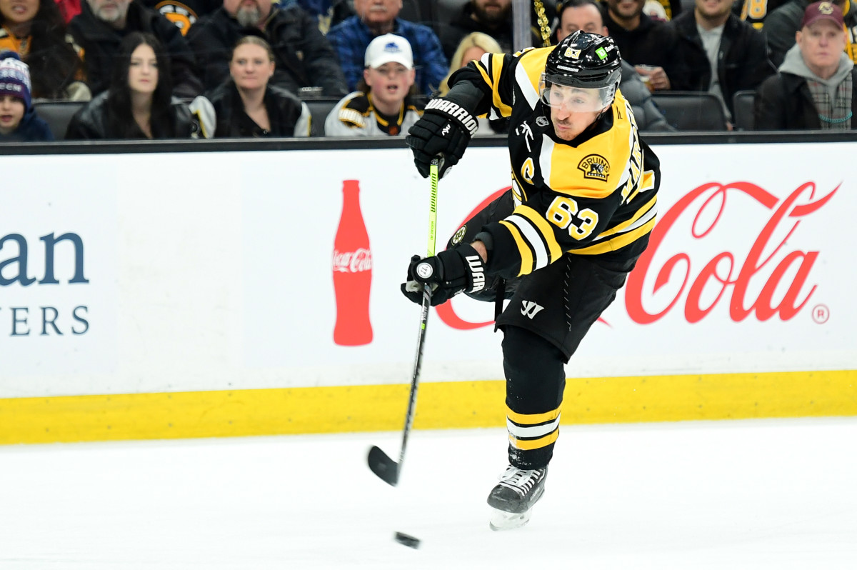 Boston Bruins left wing Brad Marchand (63) shoots the puck on goal.