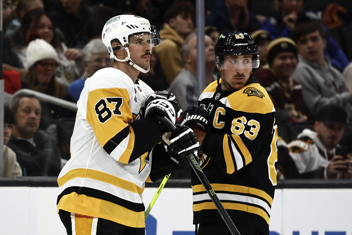 Captains, Pittsburgh Penguins center Sidney Crosby (87) and Boston Bruins left wing Brad Marchand (63).