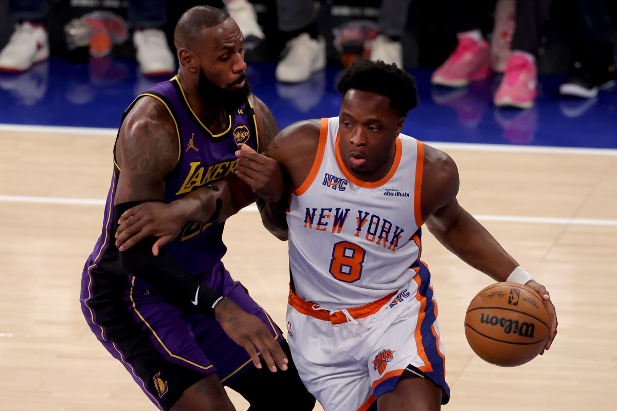 New York Knicks forward OG Anunoby (8) and Los Angeles Lakers forward LeBron James (23).