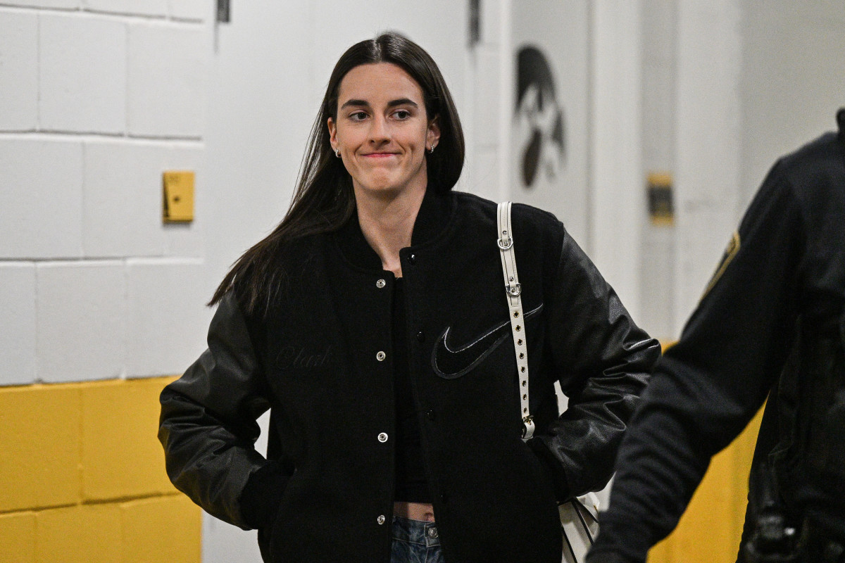 Feb 2, 2025; Iowa City, Iowa, USA; Former Iowa Hawkeyes player Caitlin Clark enters Carver-Hawkeye Arena before the game against the USC Trojans. The Hawkeyes will be retiring the jersey of Clark after the game. Mandatory Credit: Jeffrey Becker-Imagn Images  