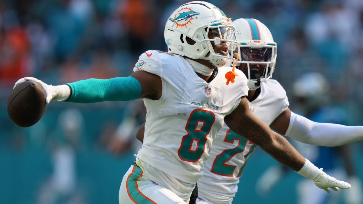 Miami Dolphins free safety Jevon Holland (8) celebrates after intercepting a pass during the first half at Hard Rock Stadium.