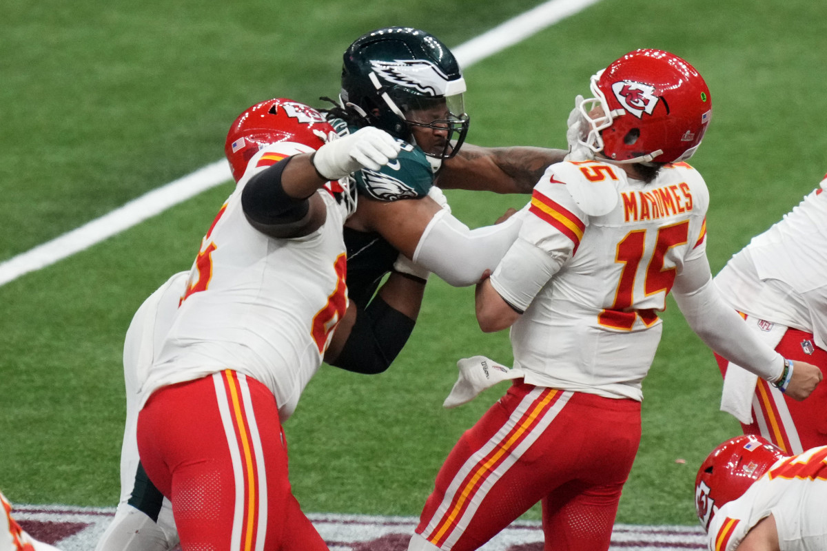 Feb 9, 2025; New Orleans, LA, USA; Kansas City Chiefs quarterback Patrick Mahomes (15) is sacked by Philadelphia Eagles defensive tackle Jalen Carter (98) and defensive tackle Milton Williams (93) during the fourth quarter in Super Bowl LIX at Caesars Superdome. Mandatory Credit: Kirby Lee-Imagn Images