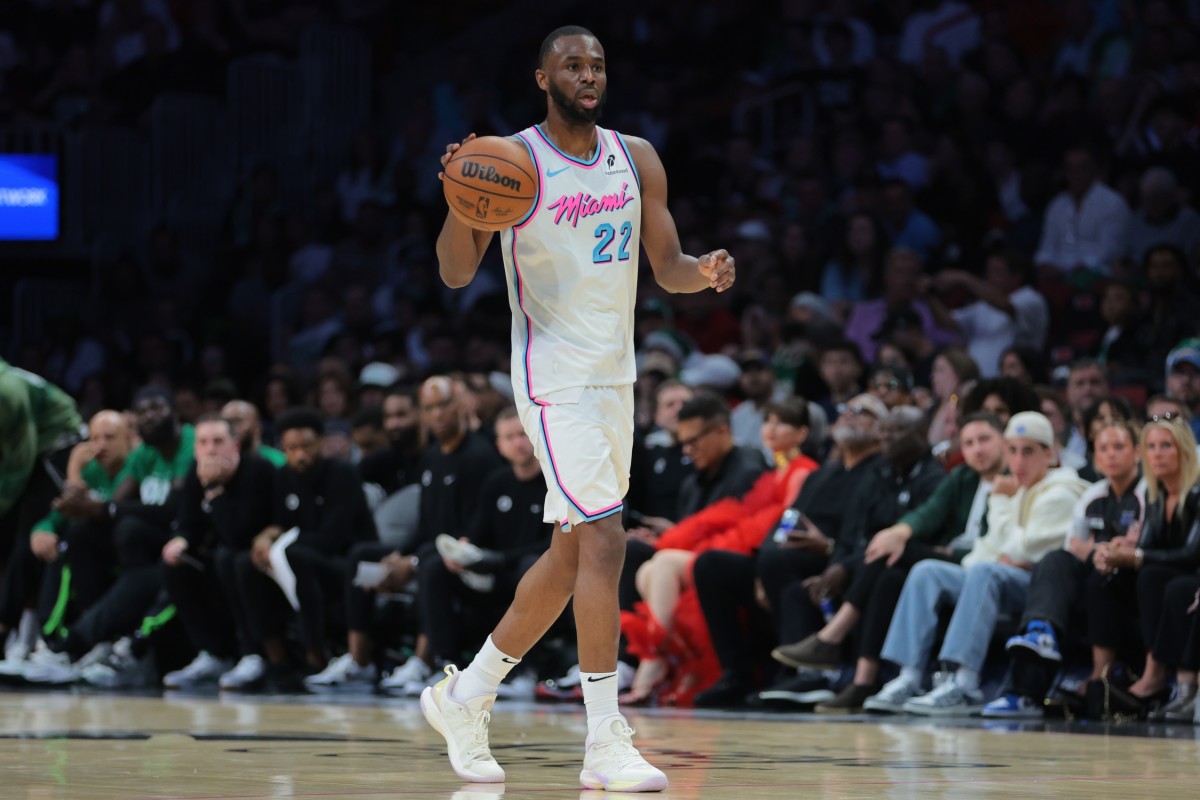 Andrew Wiggins dribbles the basketball against the Boston Celtics at Kaseya Center.