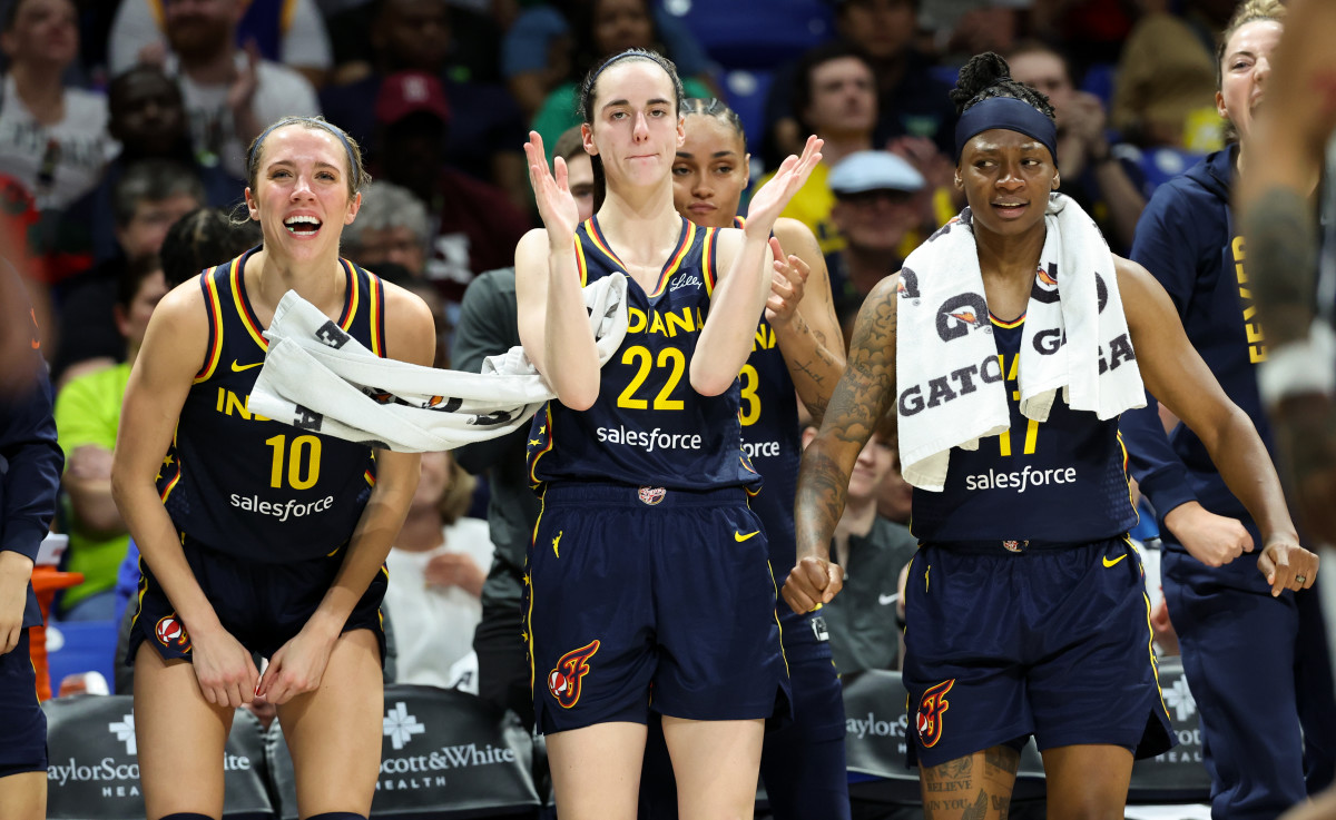 Indiana Fever guards Caitlin Clark (22), Lexie Hull (10) and Erica Wheeler