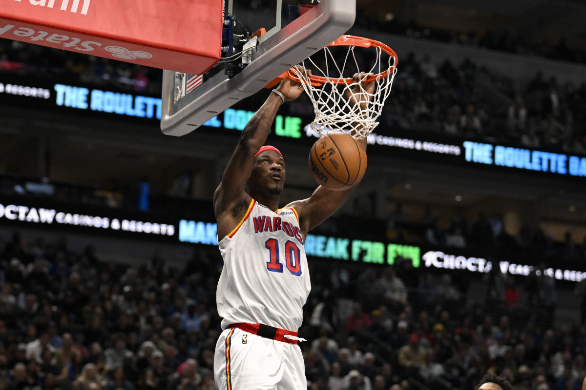 Golden State Warriors forward Jimmy Butler dunks during a game against the Dallas Mavericks.