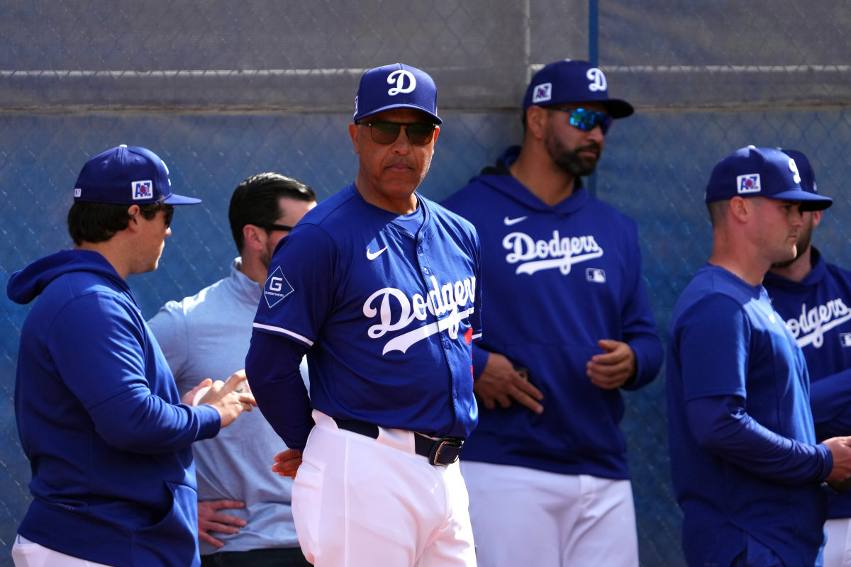 Los Angeles Dodgers manager Dave Roberts (30) looks on during a Spring Training workout at Camelback Ranch.