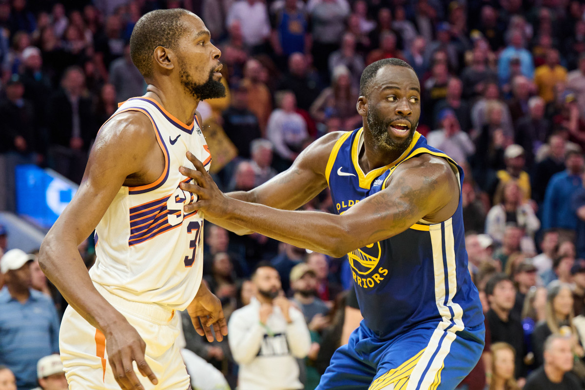 Golden State Warriors forward Draymond Green guards Phoenix Suns forward Kevin Durant