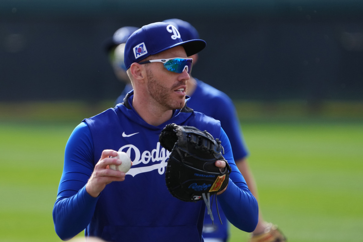 Los Angeles Dodgers first base Freddie Freeman (5) throws during a Spring Training workout at Camelback Ranch.