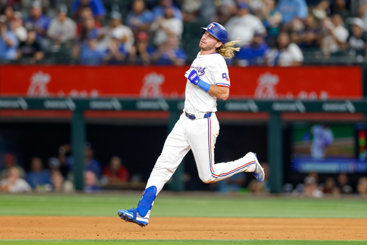 Texas, USA; Texas Rangers outfielder Travis Jankowski (16) hits a double during the eighth inning against the Seattle Mariners at Globe Life Field.