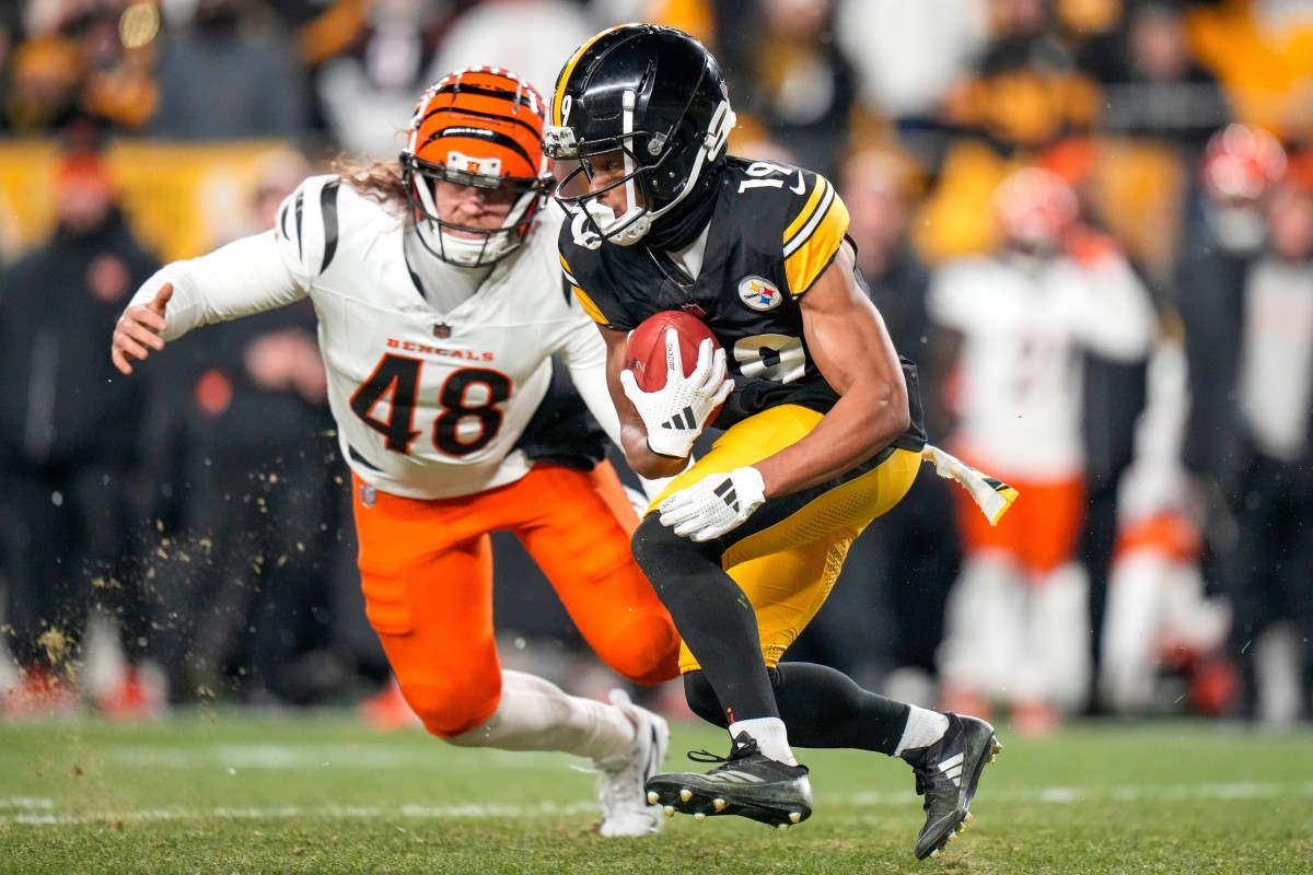 Pittsburgh Steelers wide receiver Calvin Austin III (19) is stopped by Cincinnati Bengals long snapper Cal Adomitis (48) on a punt return in the fourth quarter of the NFL Week 18 game between the Pittsburgh Steelers and the Cincinnati Bengals at Acrisure Stadium in Pittsburgh on Saturday, Jan. 4, 2025. The Bengals won 19-17 to finish the regular season at 9-8.  