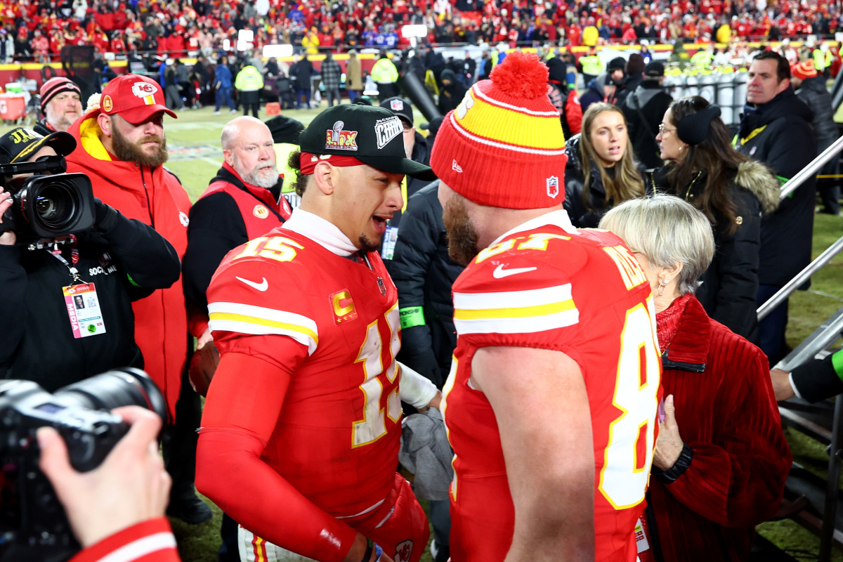 Kansas City Chiefs quarterback Patrick Mahomes (15) and tight end Travis Kelce (87) react after the AFC Championship game against the Buffalo Bills at GEHA Field at Arrowhead Stadium.