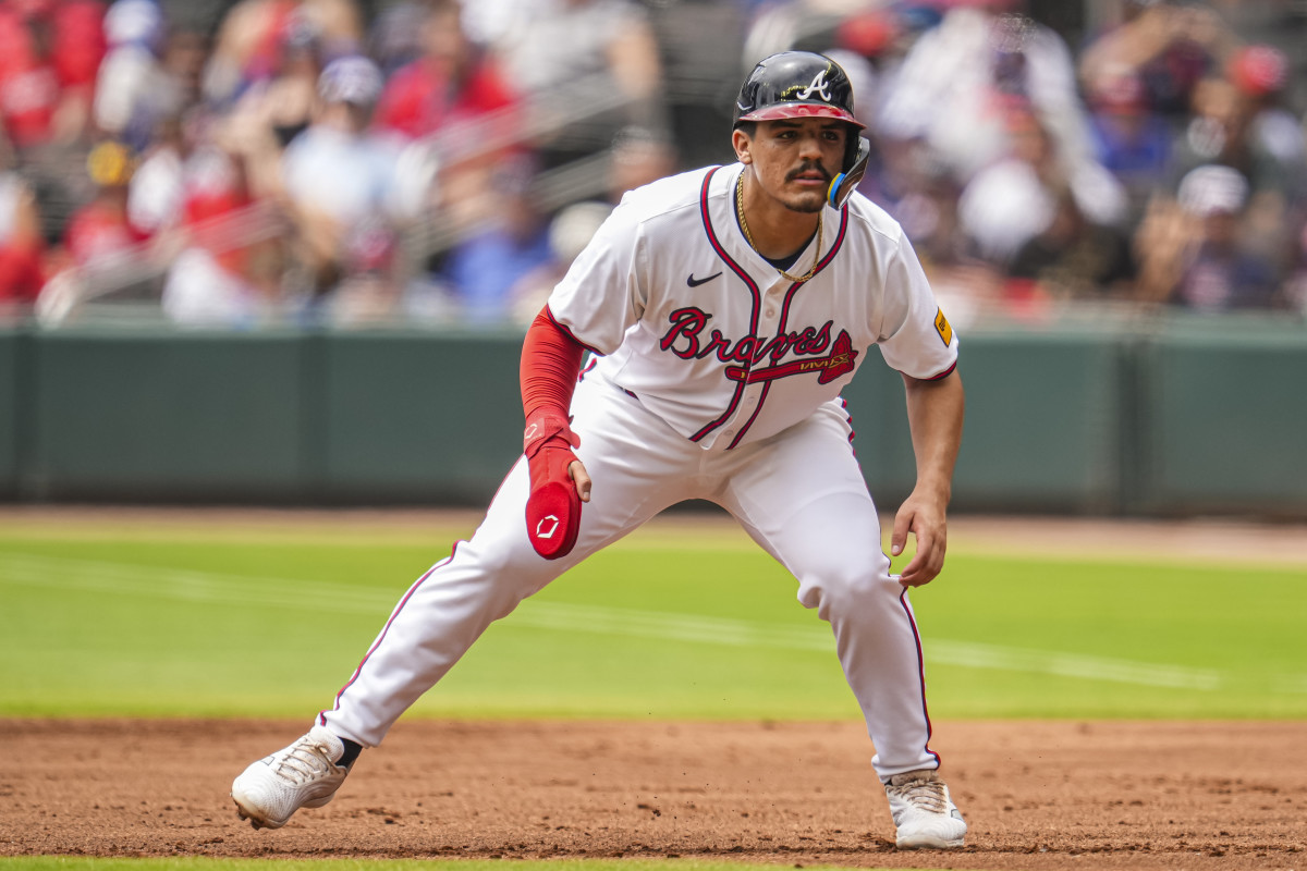 Braves' infielder Nacho Alvarez Jr. looks ready on first base during a 2024 matchup against the Reds in Truist Park.