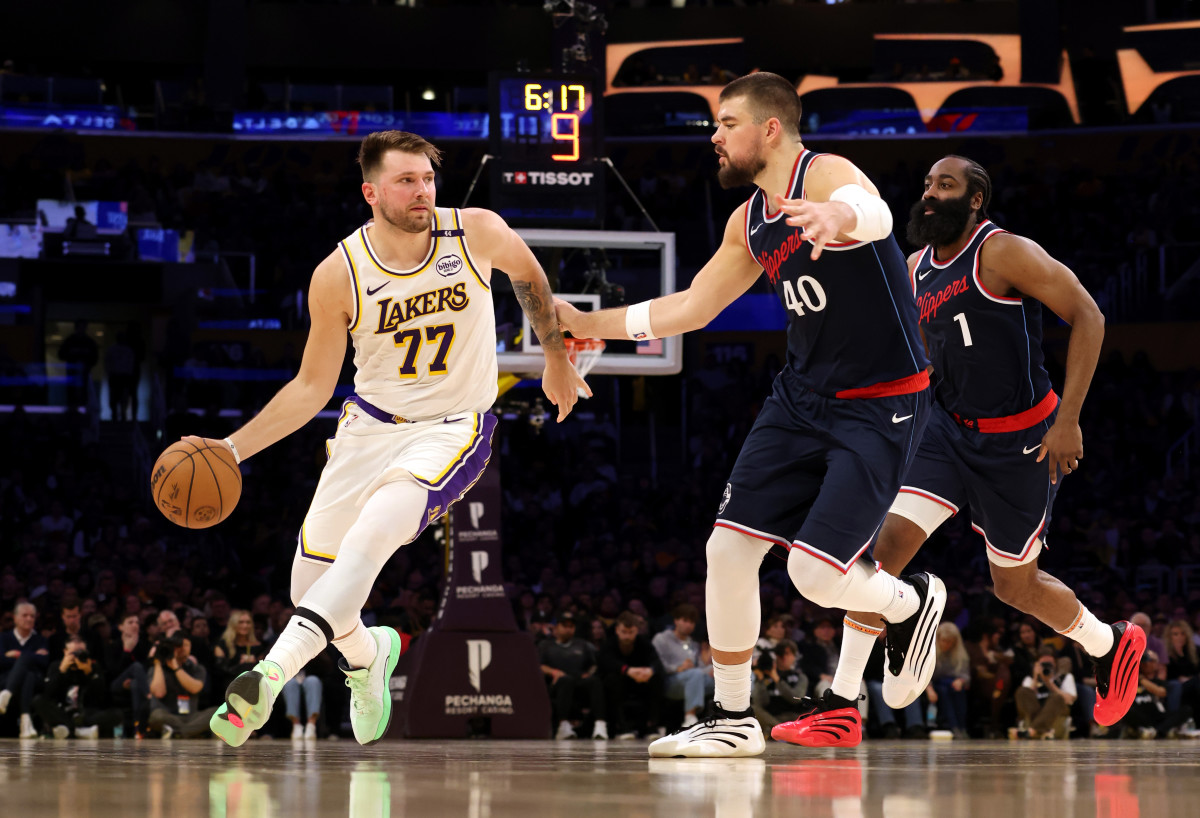 Los Angeles Lakers guard Luka Doncic (77) and LA Clippers center Ivica Zubac (40).