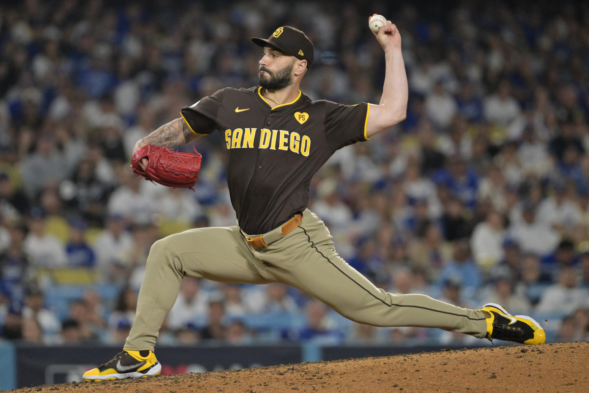 San Diego Padres pitcher Tanner Scott (66) pitches against the Los Angeles Dodgers in the eighth inning during game two of the NLDS for the 2024 MLB Playoffs at Dodger Stadium. 