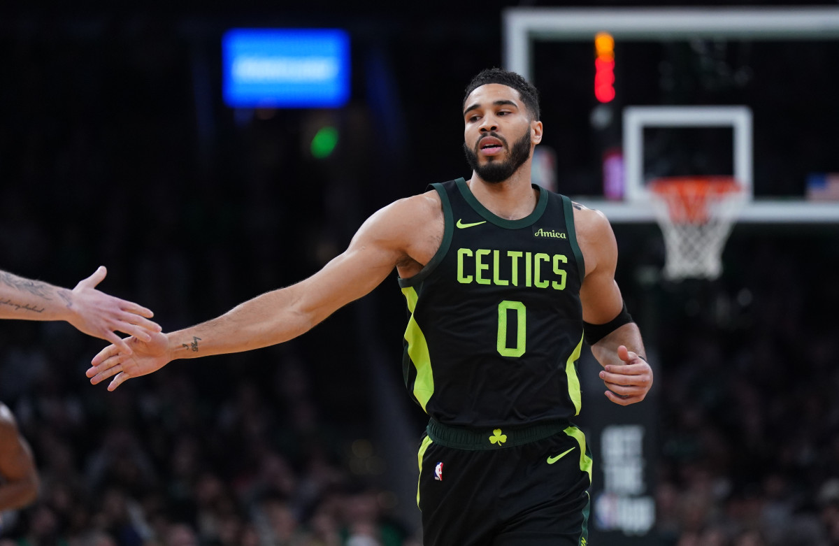 Jayson Tatum reacts after his basket against the Philadelphia 76ers at TD Garden.