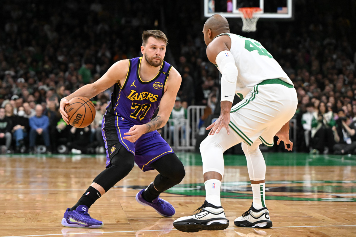 Los Angeles Lakers guard Luka Doncic dribbles the ball against Boston Celtics center Al Horford