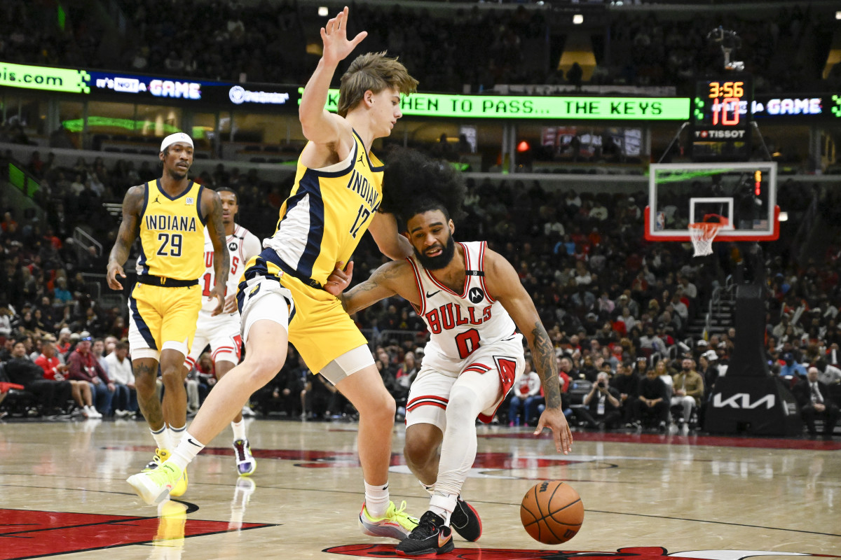 Bulls guard Coby White dribbles against Pacers forward Johnny Furphy.