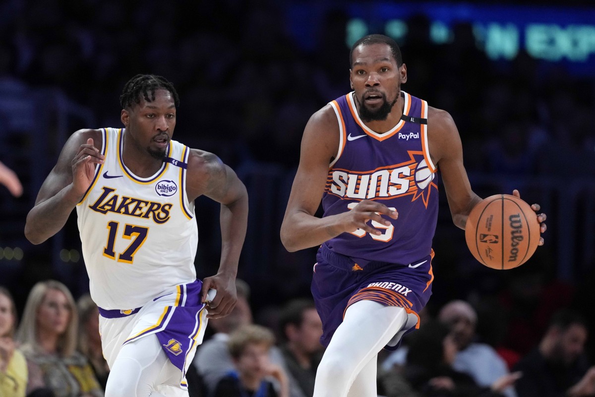 Phoenix Suns forward Kevin Durant pushes the ball upcourt as Los Angeles Lakers forward Dorian Finney-Smith defends at Crypto.com Arena on March 16, 2025.