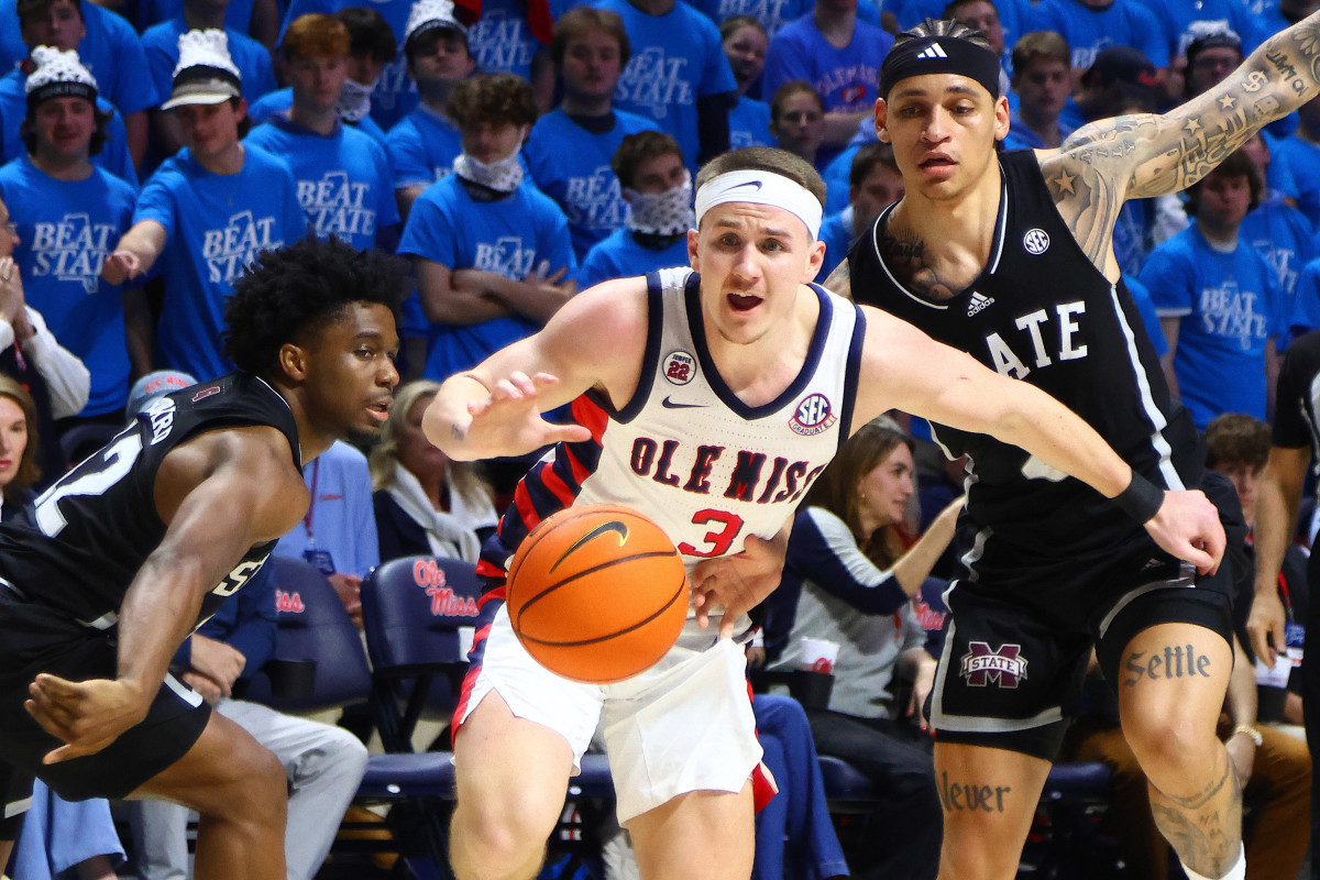 Ole Miss guard Sean Pedulla (3) chases a loose ball as Mississippi State Bulldogs guard Josh Hubbard (12) and guard Riley Kugel (2) defend.