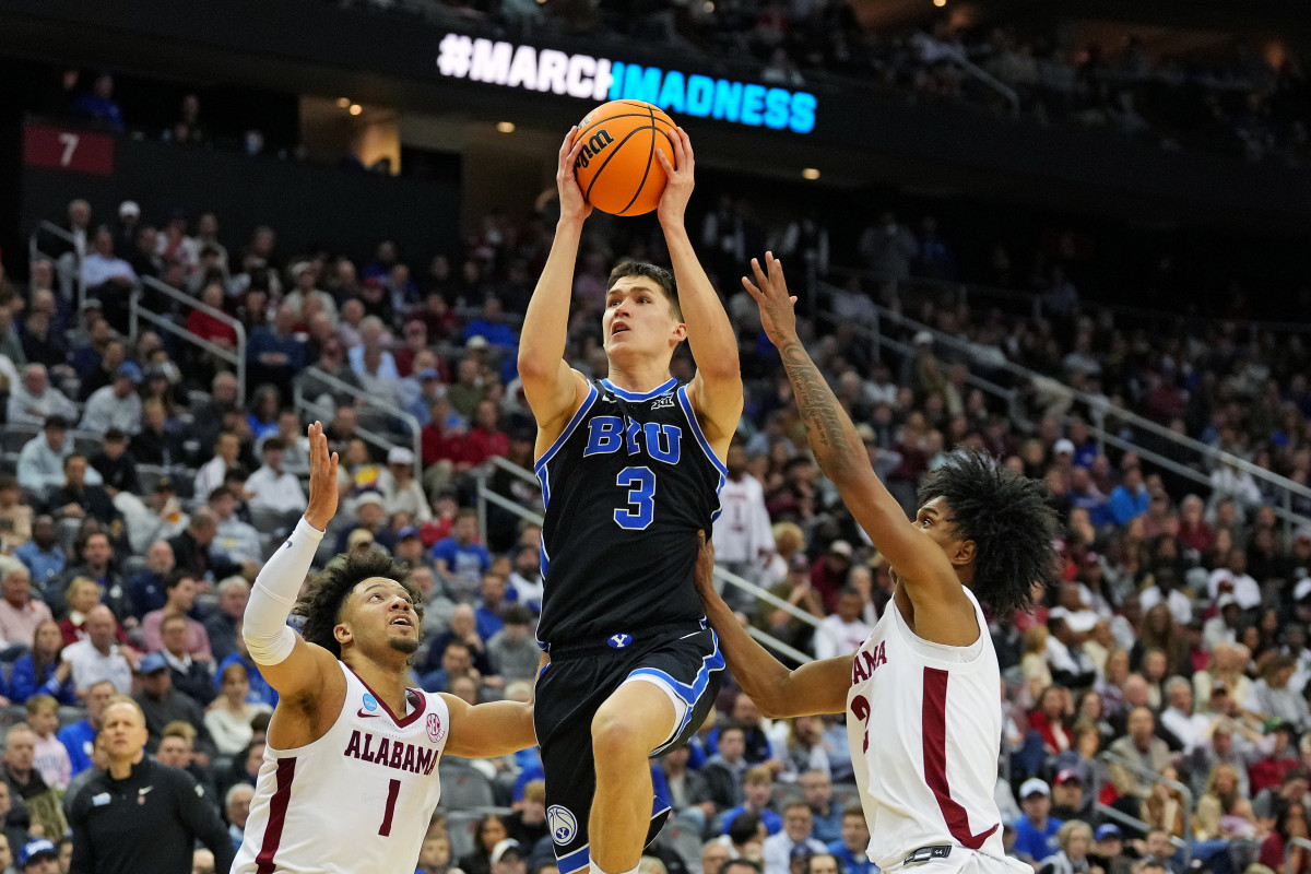 Brigham Young Cougars guard Egor Demin (3) drives to the basket against Alabama Crimson Tide guard Mark Sears (1) during the second half during an East Regional semifinal of the 2025 NCAA tournament at Prudential Center
