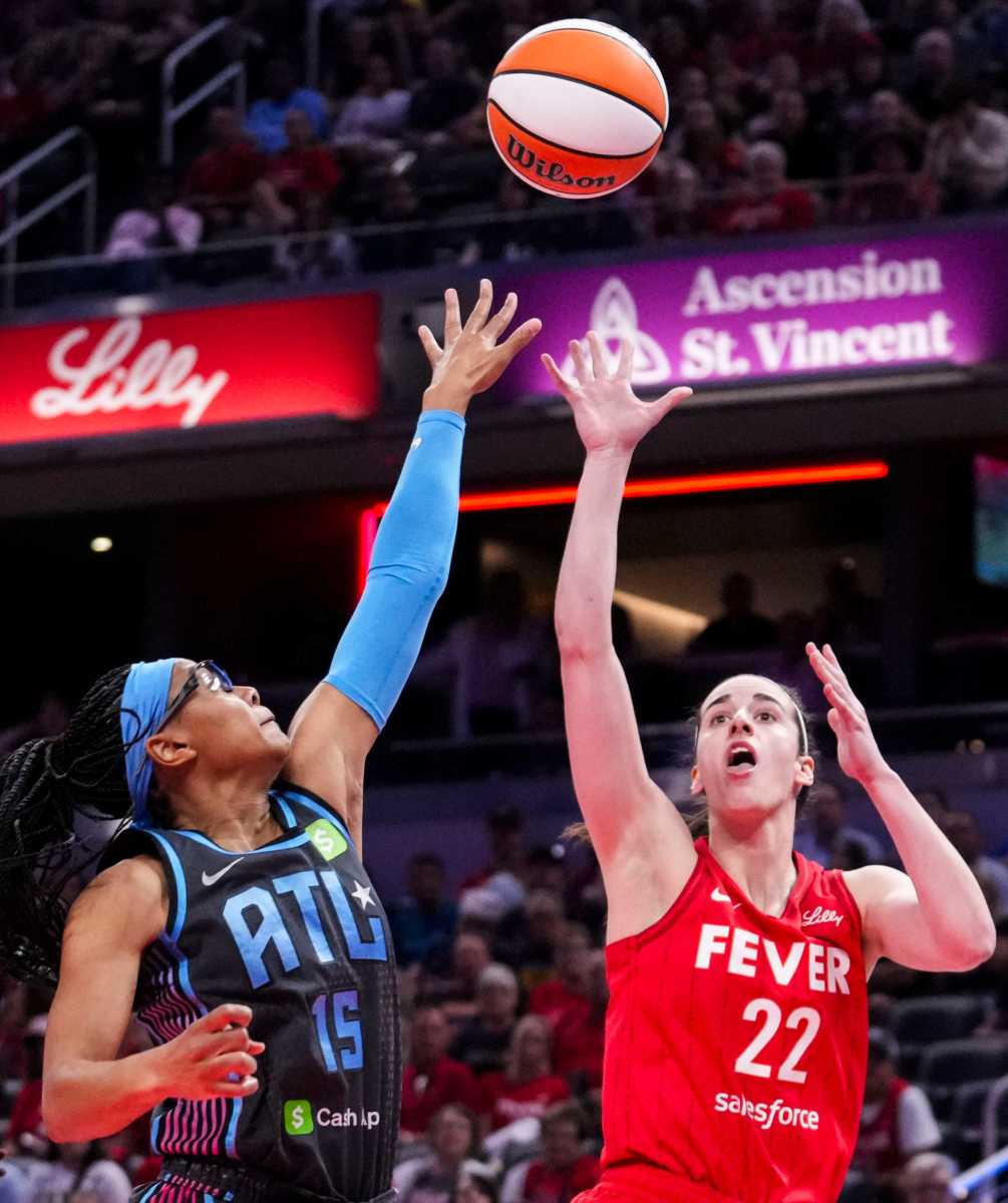 Indiana Fever guard Caitlin Clark (22) goes up for a basket against Atlanta Dream guard Allisha Gray (15) on Friday, July 11, 2025, during a game between the Indiana Fever and the Atlanta Dream at Gainbridge Fieldhouse in Indianapolis.
