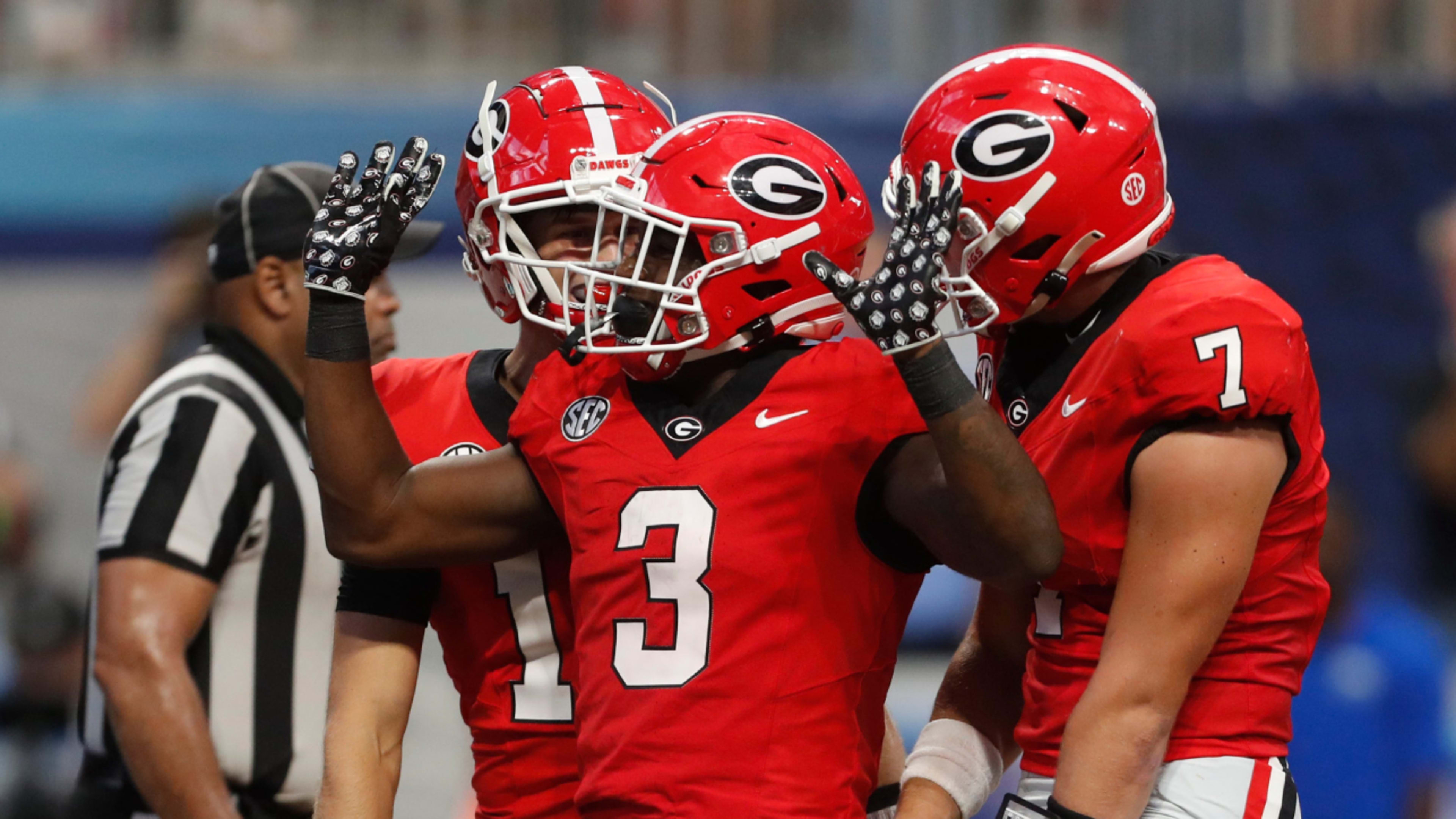 Georgia running back Nate Frazier (3) celebrates after scoring a touchdown during the second half of the NCAA Aflac Kickoff Game against Clemson in Atlanta, on Saturday, Aug. 31, 2024.  