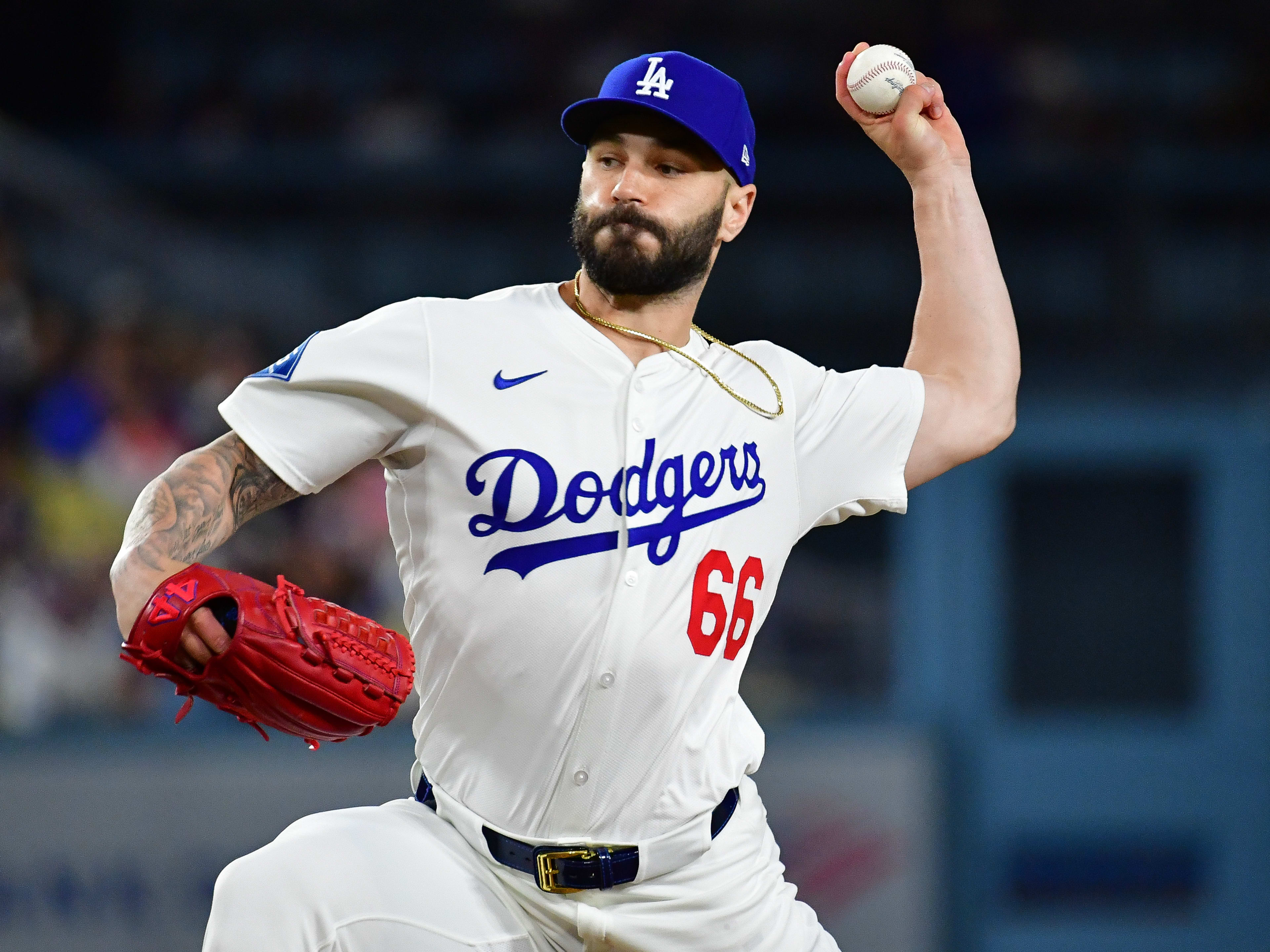Los Angeles Dodgers pitcher Tanner Scott (66) throws against the New York Mets during the tenth inning at Dodger Stadium.