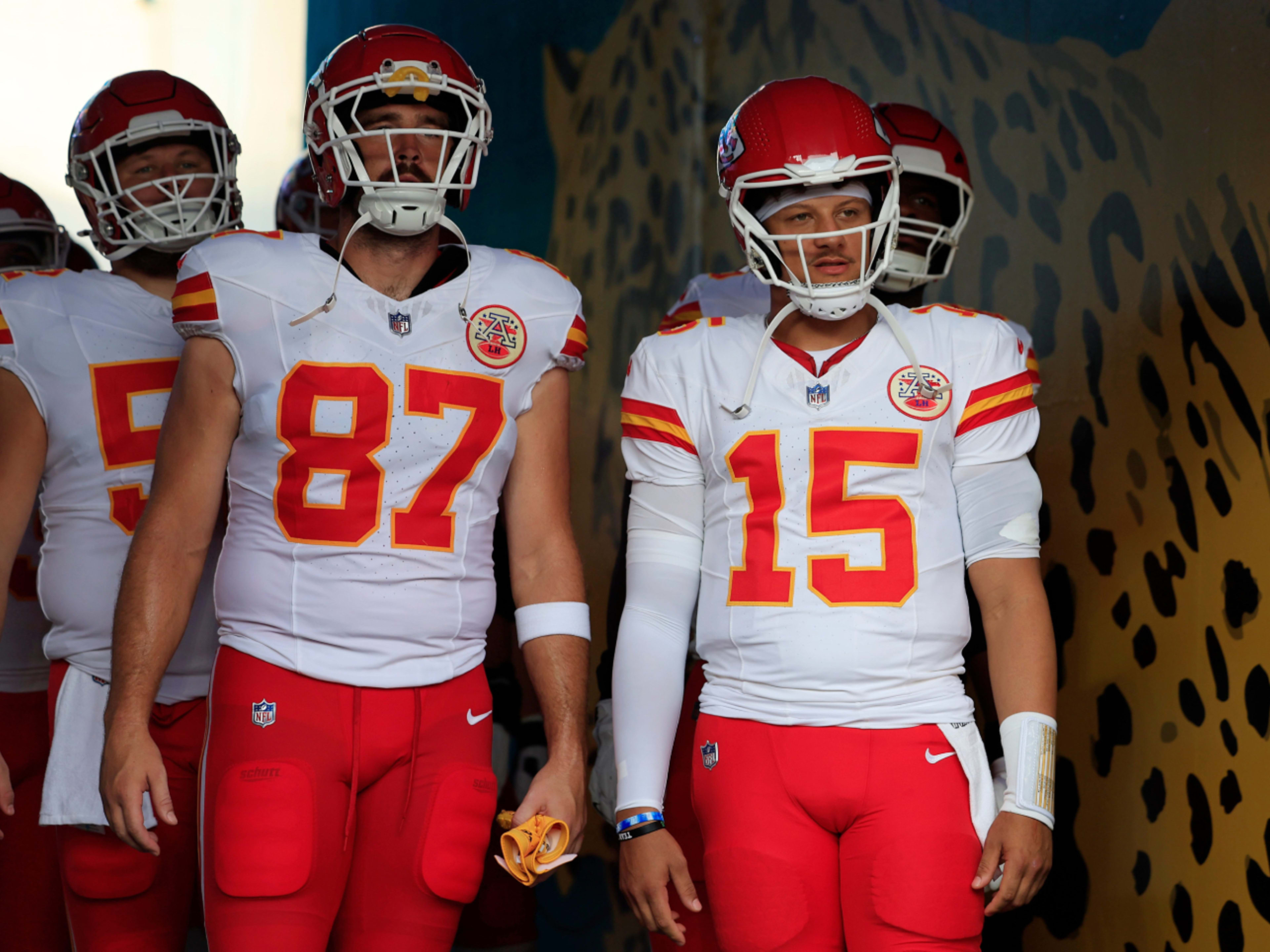 Chiefs quarterback Patrick Mahomes (15) looks on next to tight end Travis Kelce (87) before a preseason game against the Jaguars. 