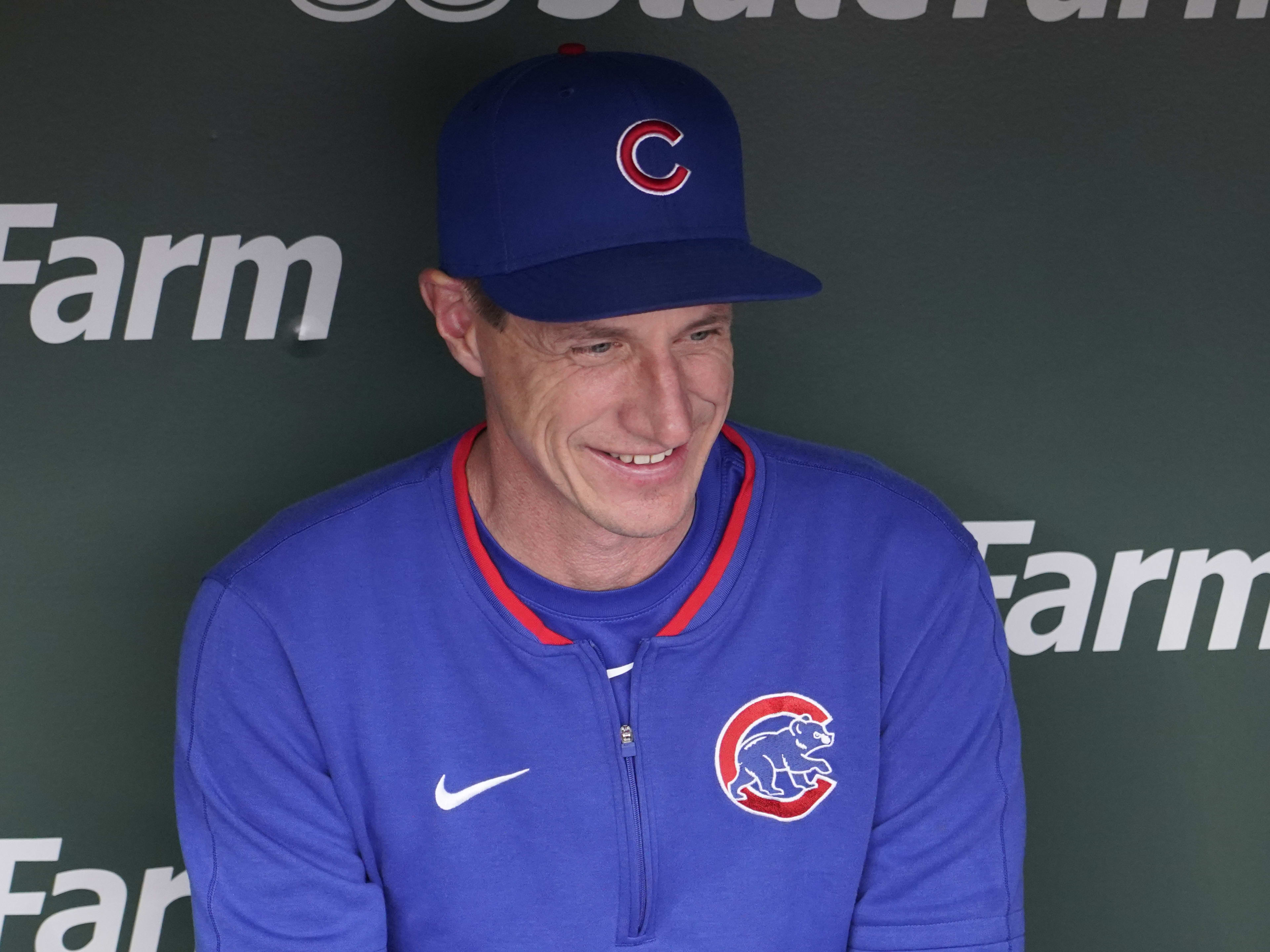 Chicago Cubs manager Craig Counsell (11) talks with reporters before a game against the Colorado Rockies at Wrigley Field.