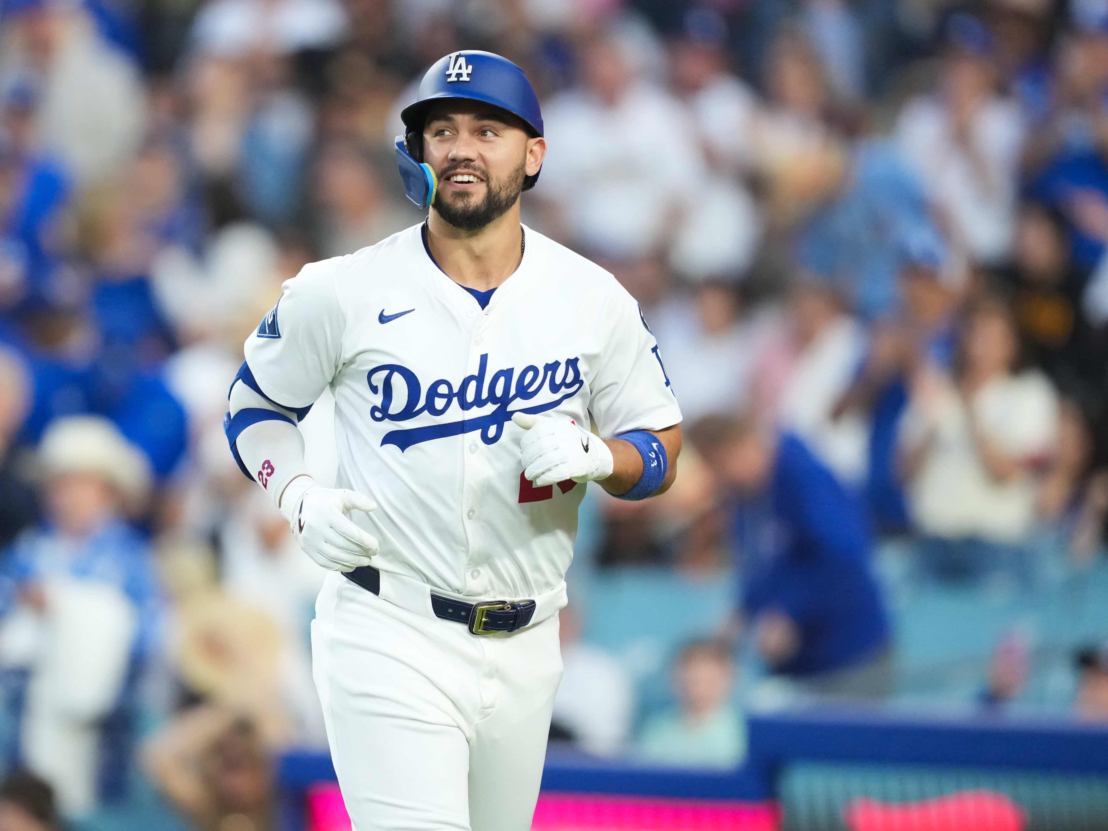 Los Angeles Dodgers left fielder Michael Conforto (23) celebrates after hitting a two-run home run during the third inning against the Chicago White Sox at Dodger Stadium.