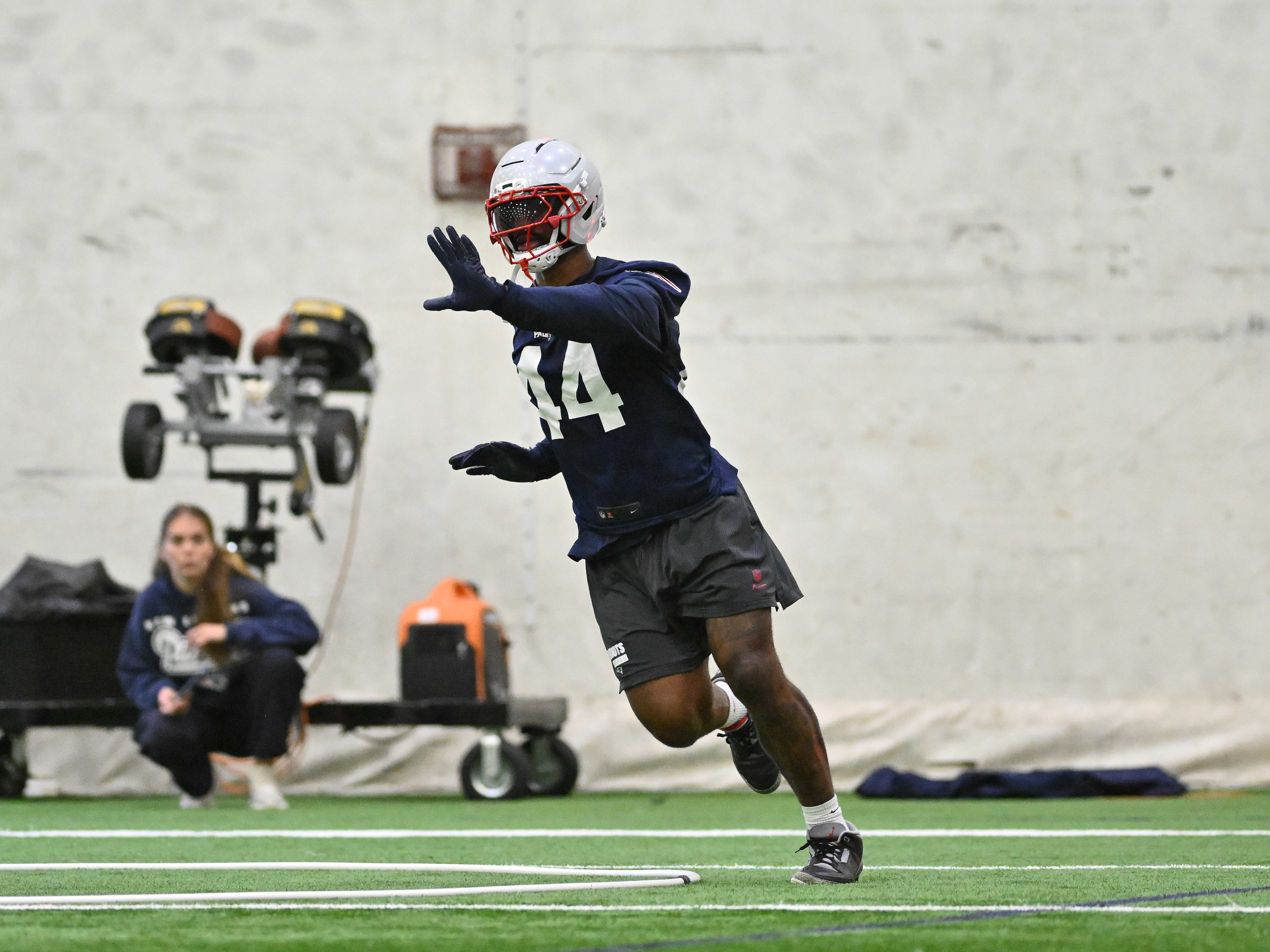 New England Patriots linebacker K'Lavon Chaisson (44) runs through a drill during minicamp held in the WIN Field House at Gillette Stadium.