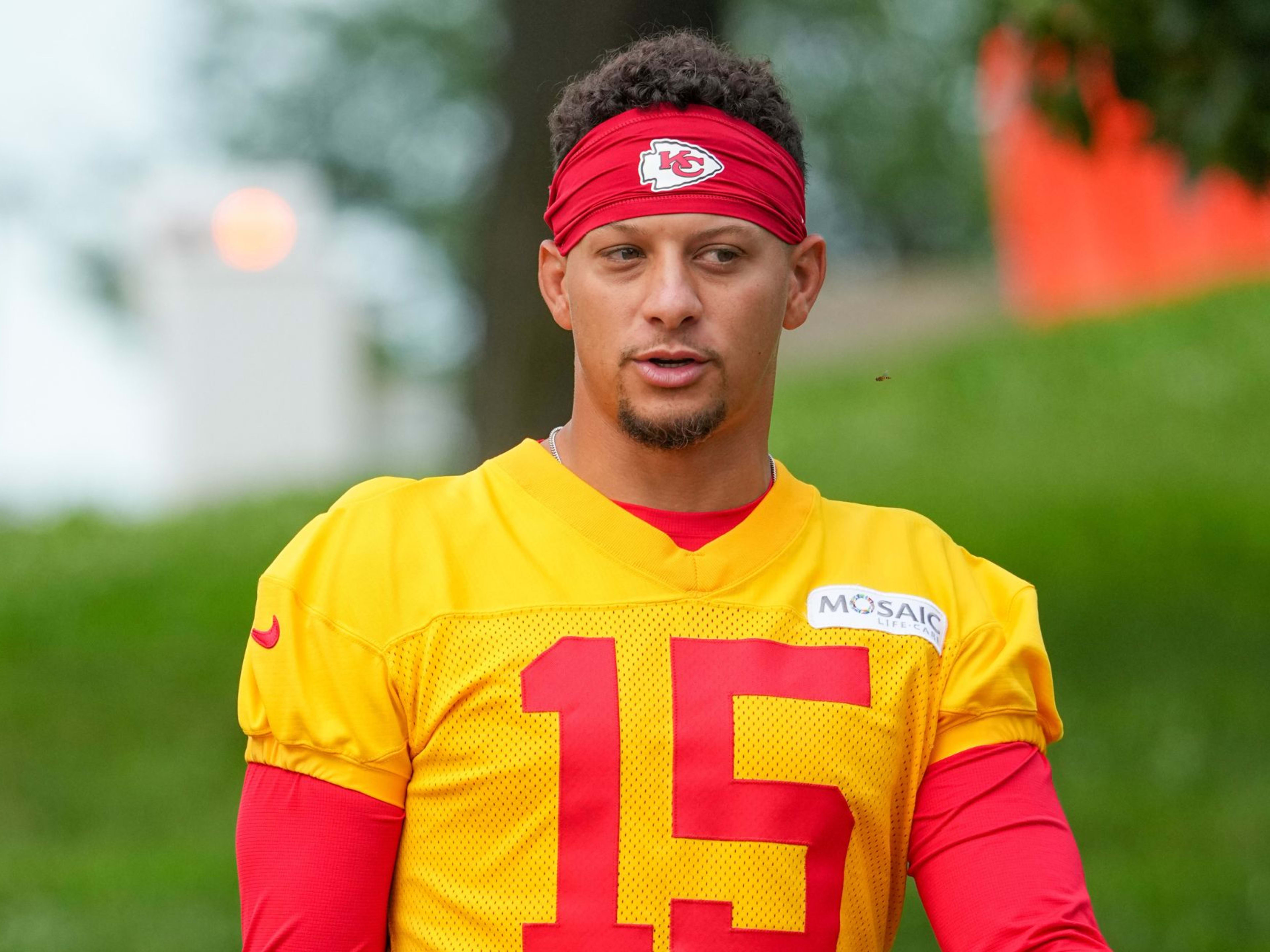 Kansas City Chiefs quarterback Patrick Mahomes (15) walks down the hill to the practice fields during training camp at Missouri Western State University 