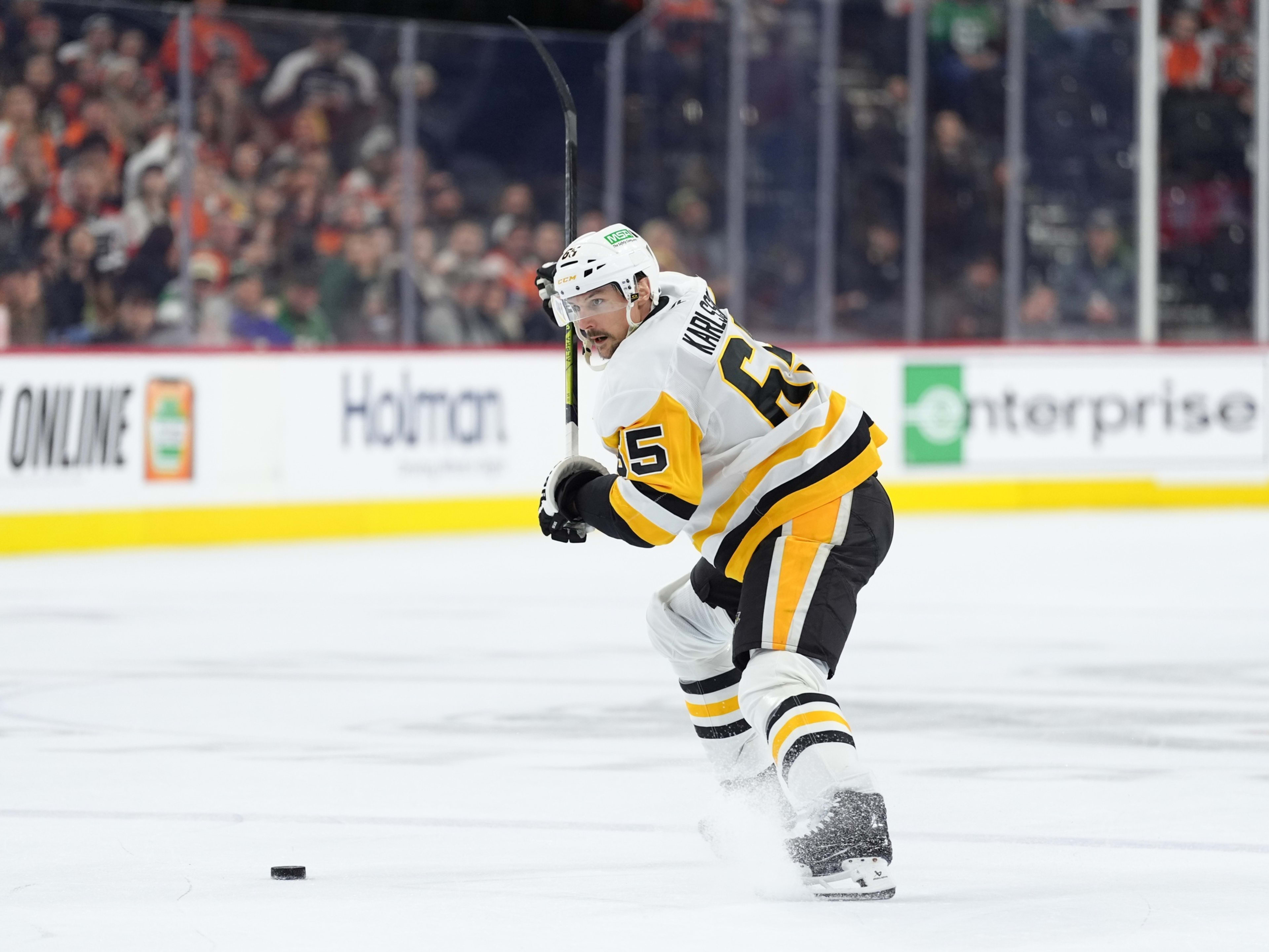 Feb 8, 2025; Philadelphia, Pennsylvania, USA; Pittsburgh Penguins defenseman Erik Karlsson (65) winds up against the Philadelphia Flyers in the third period at Wells Fargo Center. Mandatory Credit: Kyle Ross-Imagn Images
