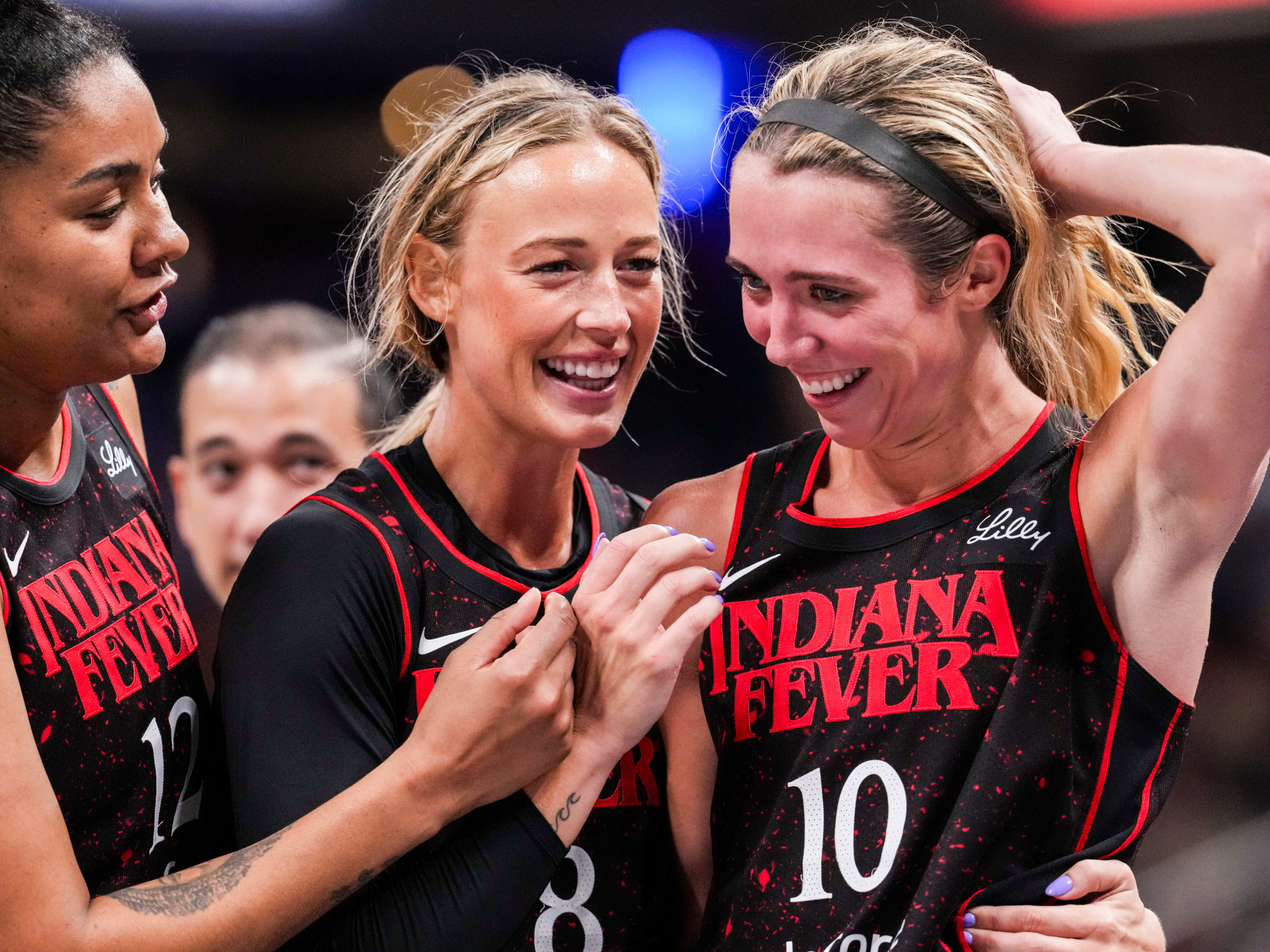 Indiana Fever guards Sophie Cunningham and Lexie Hull huddle up against the Chicago Sky.
