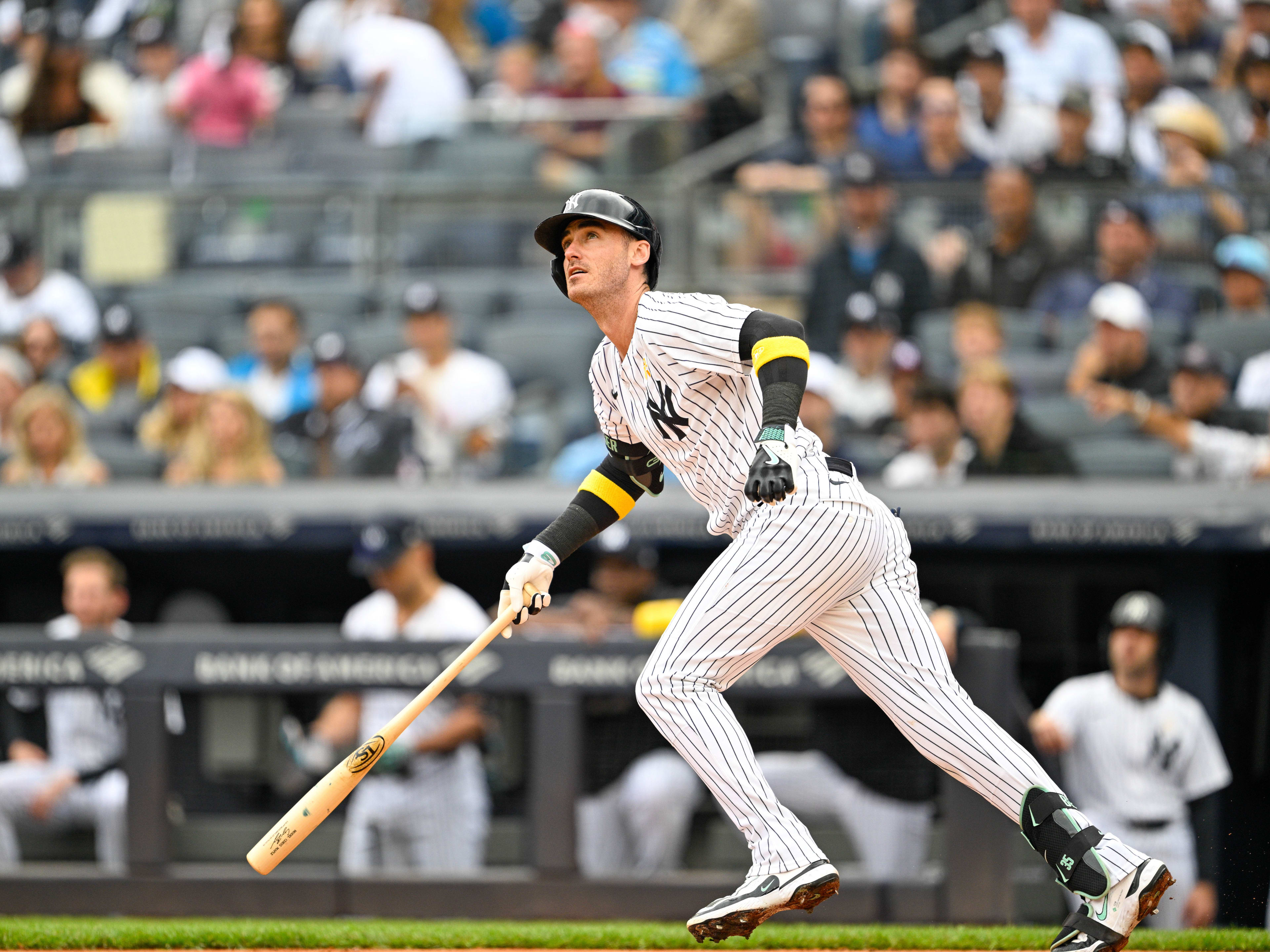 New York Yankees left fielder Cody Bellinger  hits the ball during the first inning  against the Toronto Blue Jays at Yankee Stadium. 
