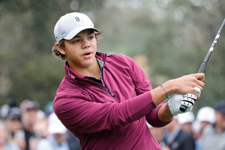 Charlie Woods plays his shot from the first tee during the PNC Championship at The Ritz-Carlton Golf Club.
