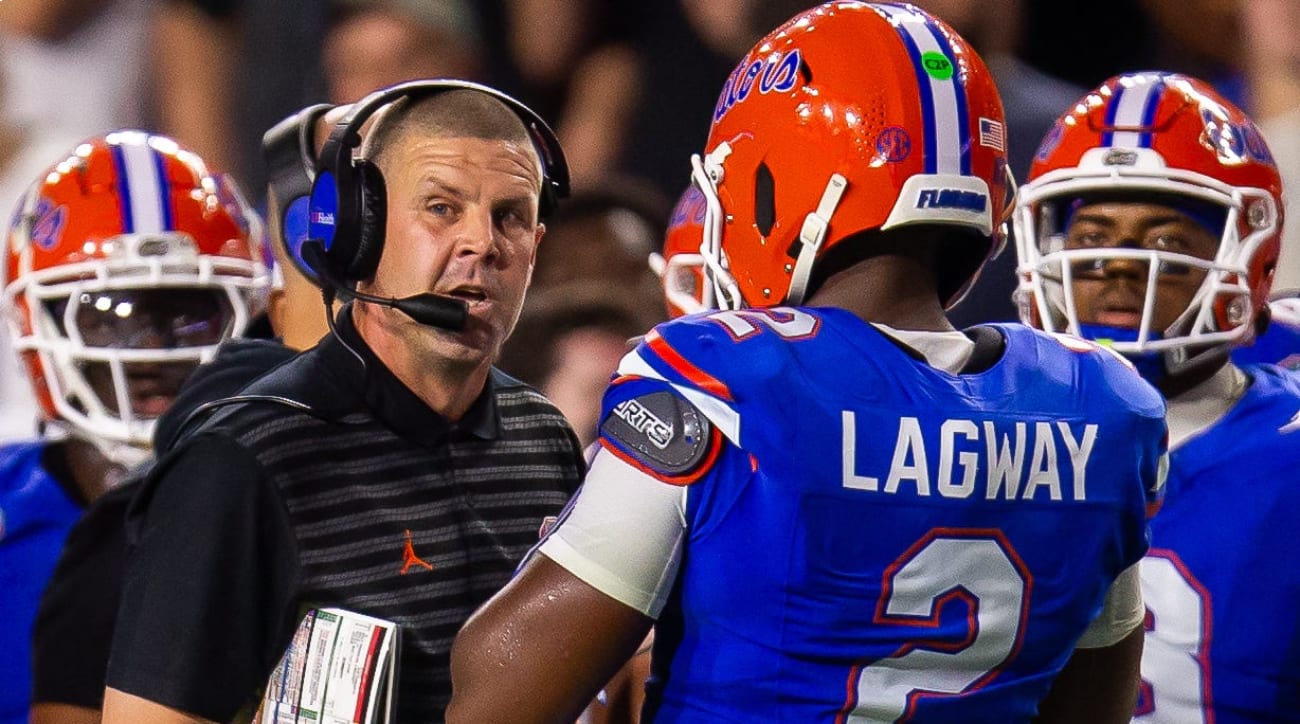Florida Gators head coach Billy Napier talks with Florida Gators quarterback DJ Lagway (2) during the first half at Ben Hill Griffin Stadium in Gainesville, FL on Saturday, October 5, 2024.