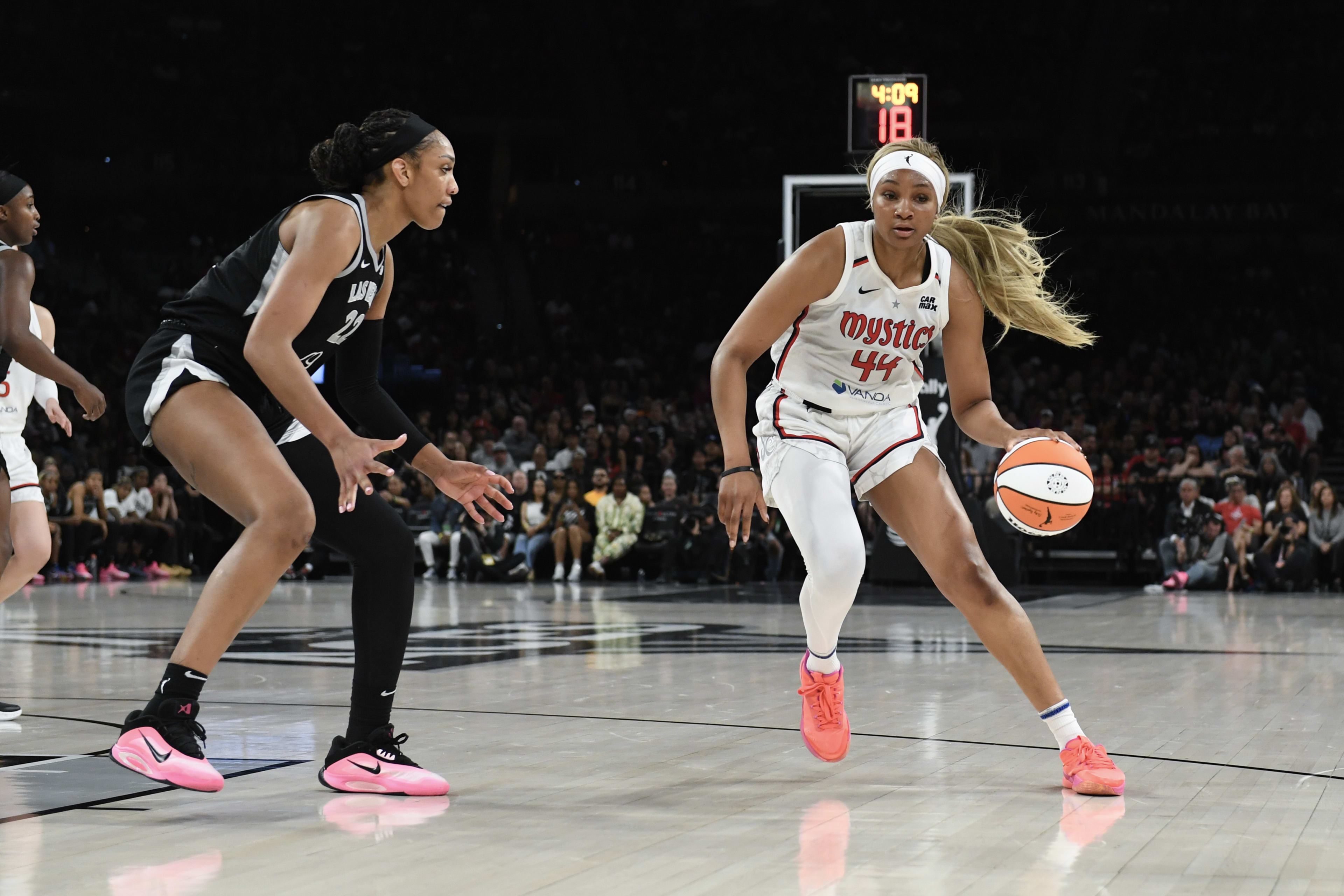 Washington Mystics forward Kiki Iriafen (44) dribbles against Las Vegas Aces center A'ja Wilson (22) in the third quarter at Michelob Ultra Arena.