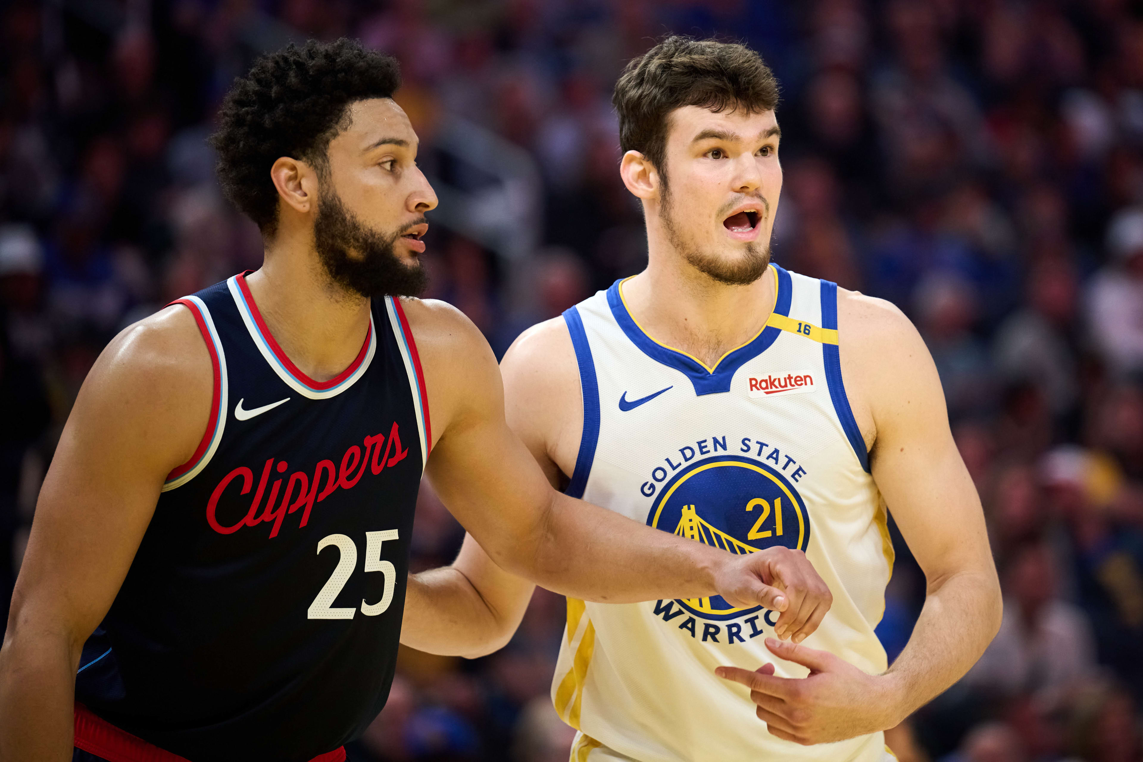 Apr 13, 2025; San Francisco, California, USA; Golden State Warriors center Quinten Post (21) gestures toward LA Clippers guard Ben Simmons (25) to confirm his defensive assignment during the first quarter at Chase Center. Mandatory Credit: Robert Edwards-Imagn Images