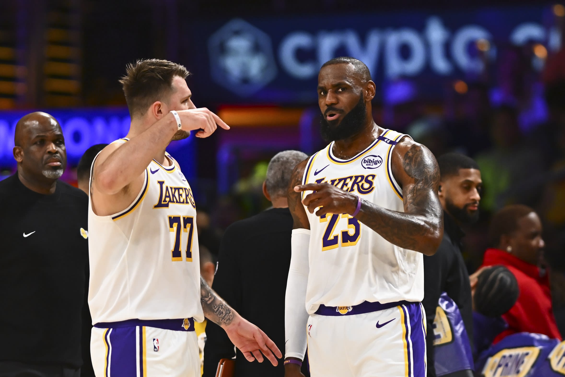 Los Angeles Lakers guard Luka Doncic (77) and forward LeBron James (23).