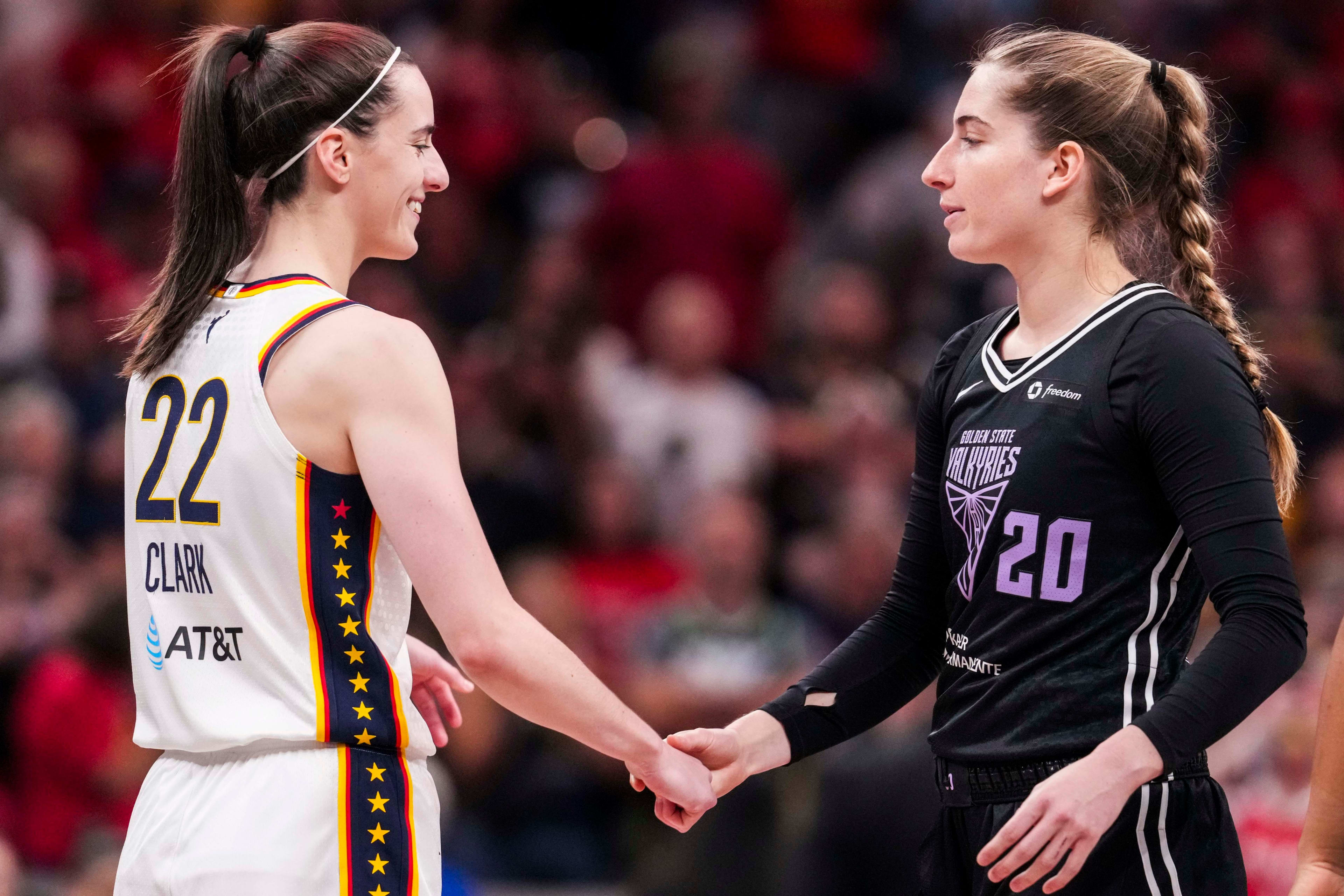 Indiana Fever guard Caitlin Clark and Golden State Valkyries guard Kate Martin during their game at Gainbridge Fieldhouse in Indianapolis on July 9, 2025.