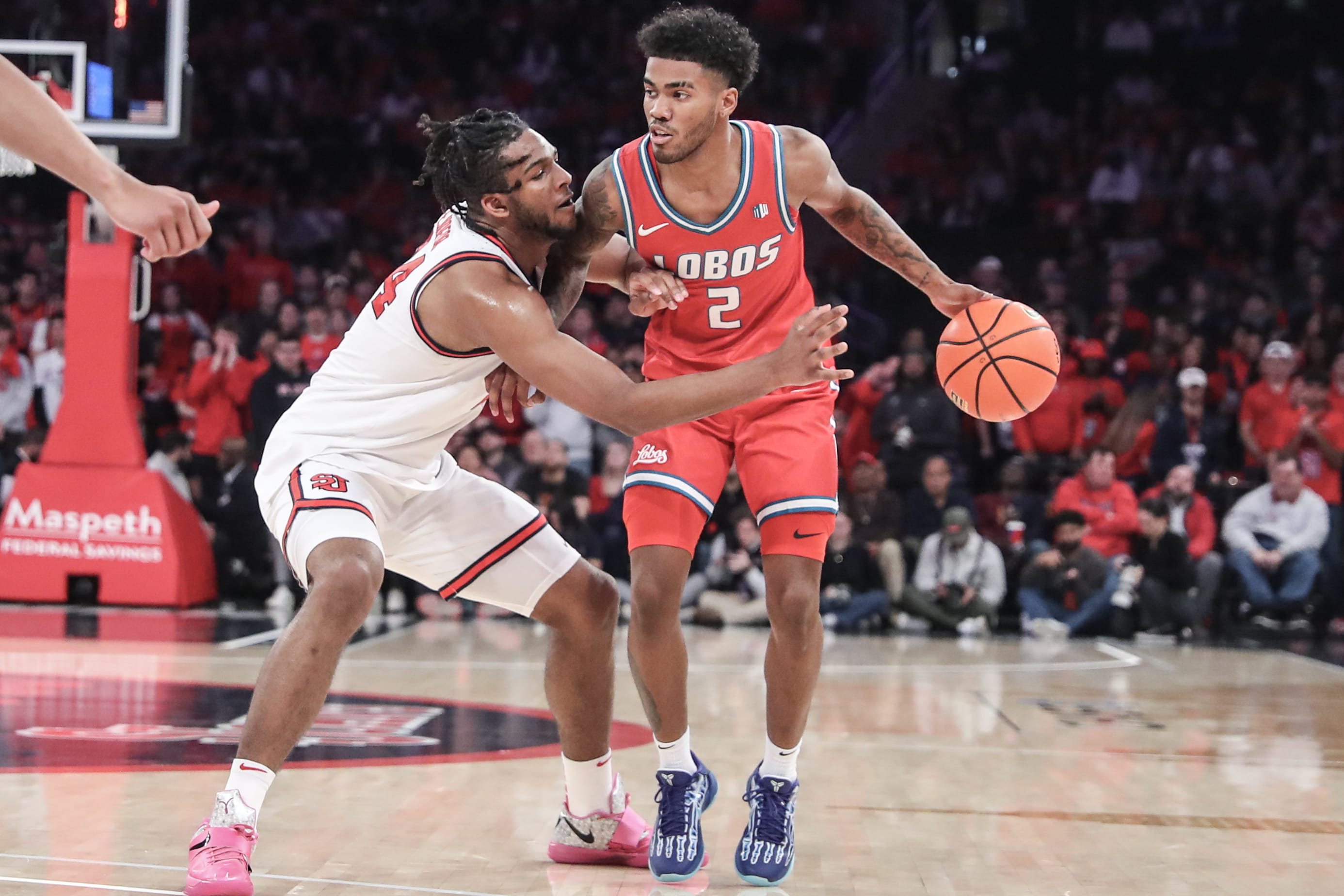 New Mexico Lobos guard Donovan Dent (2) looks to drive past St. John's Red Storm forward Zuby Ejiofor (24) in the first half at Madison Square Garden.