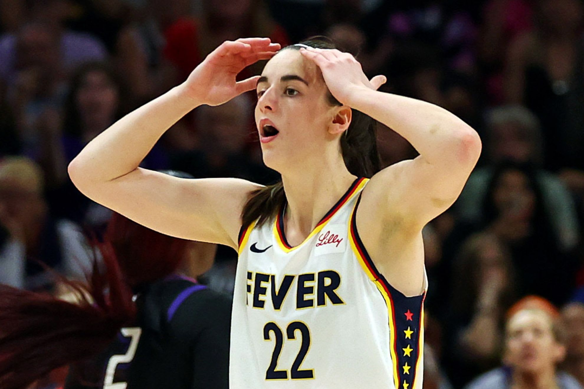 Indiana Fever guard Caitlin Clark (22) reacts to a play during the second half of the game against the Phoenix Mercury.