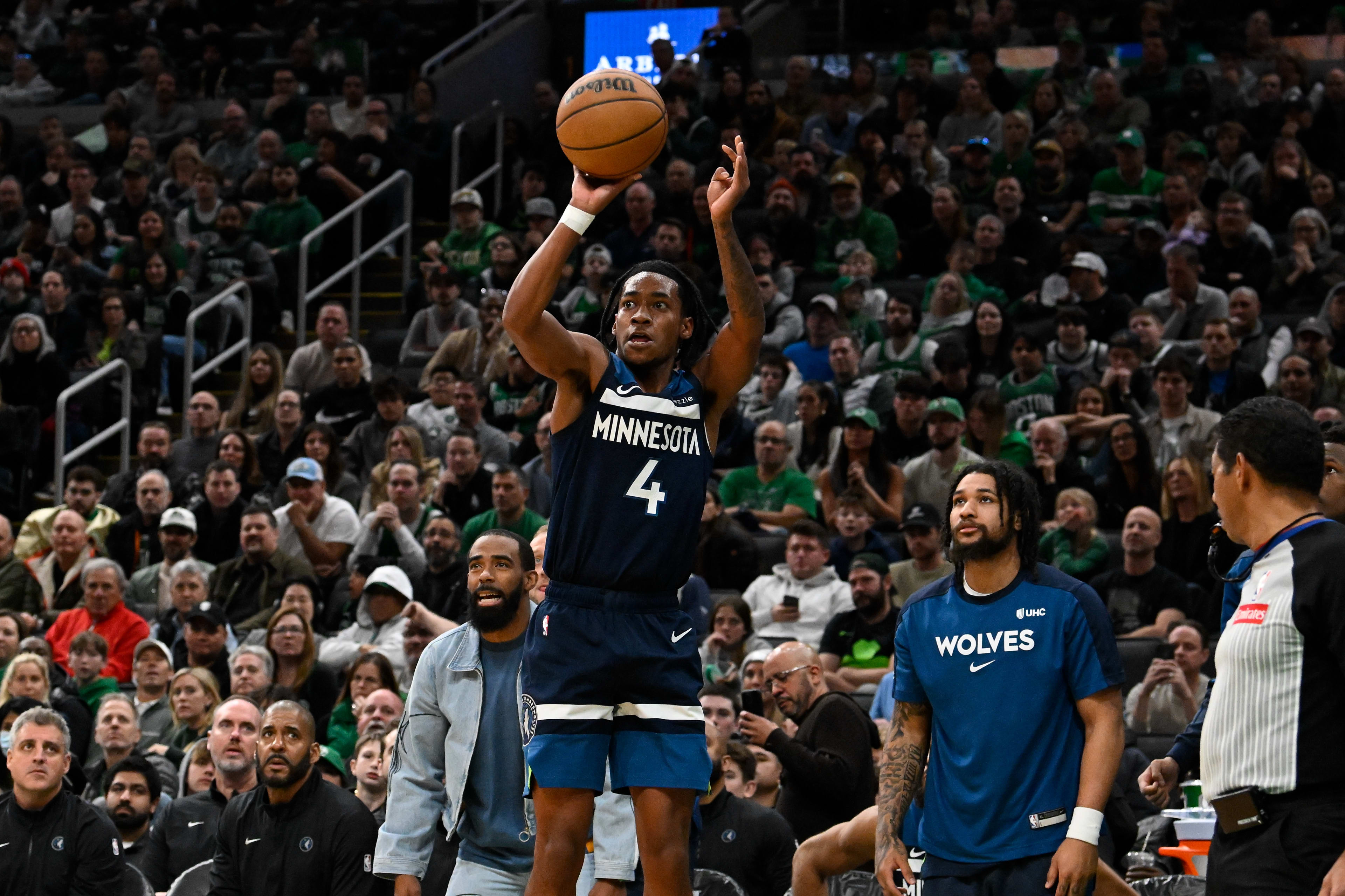Rob Dillingham shooting a corner three for the Minnesota Timberwolves against the Boston Celtics.