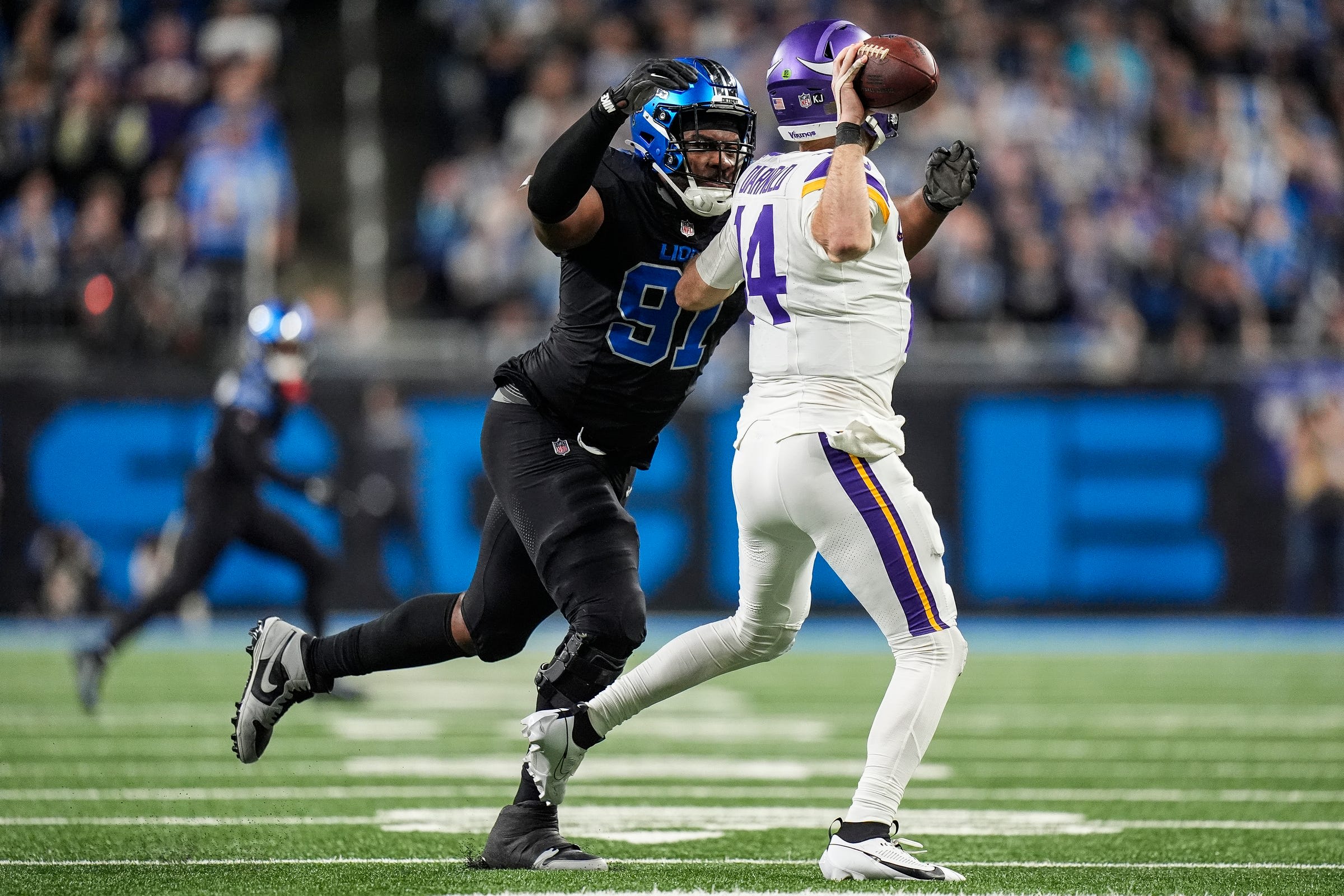 Detroit Lions defensive tackle Levi Onwuzurike chasing Sam Darnold