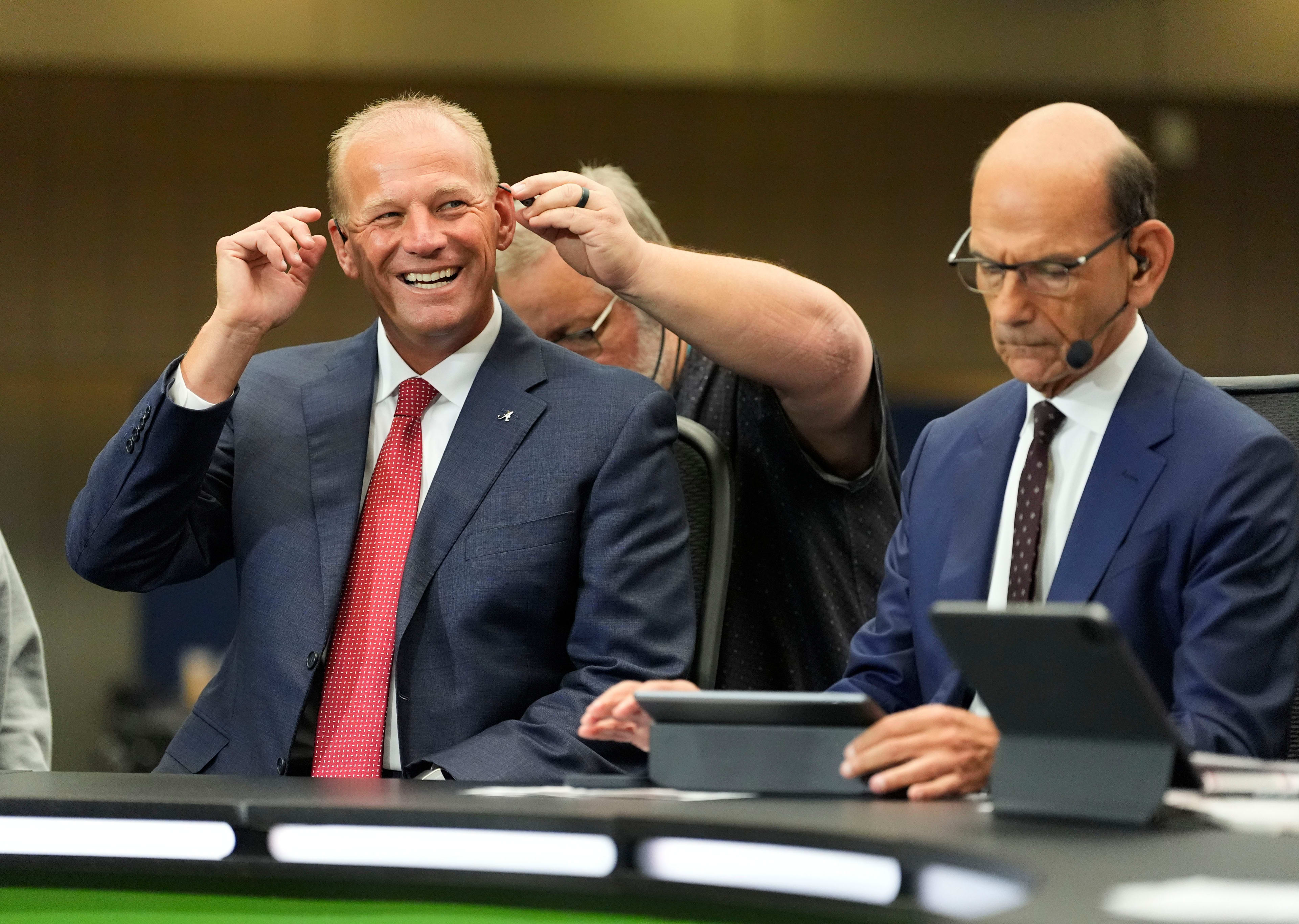 Alabama head coach Kalen DeBoer prepares for an interview with ESPN’s Paul Finebaum during SEC media days at the College Football Hall of Fame in Atlanta.