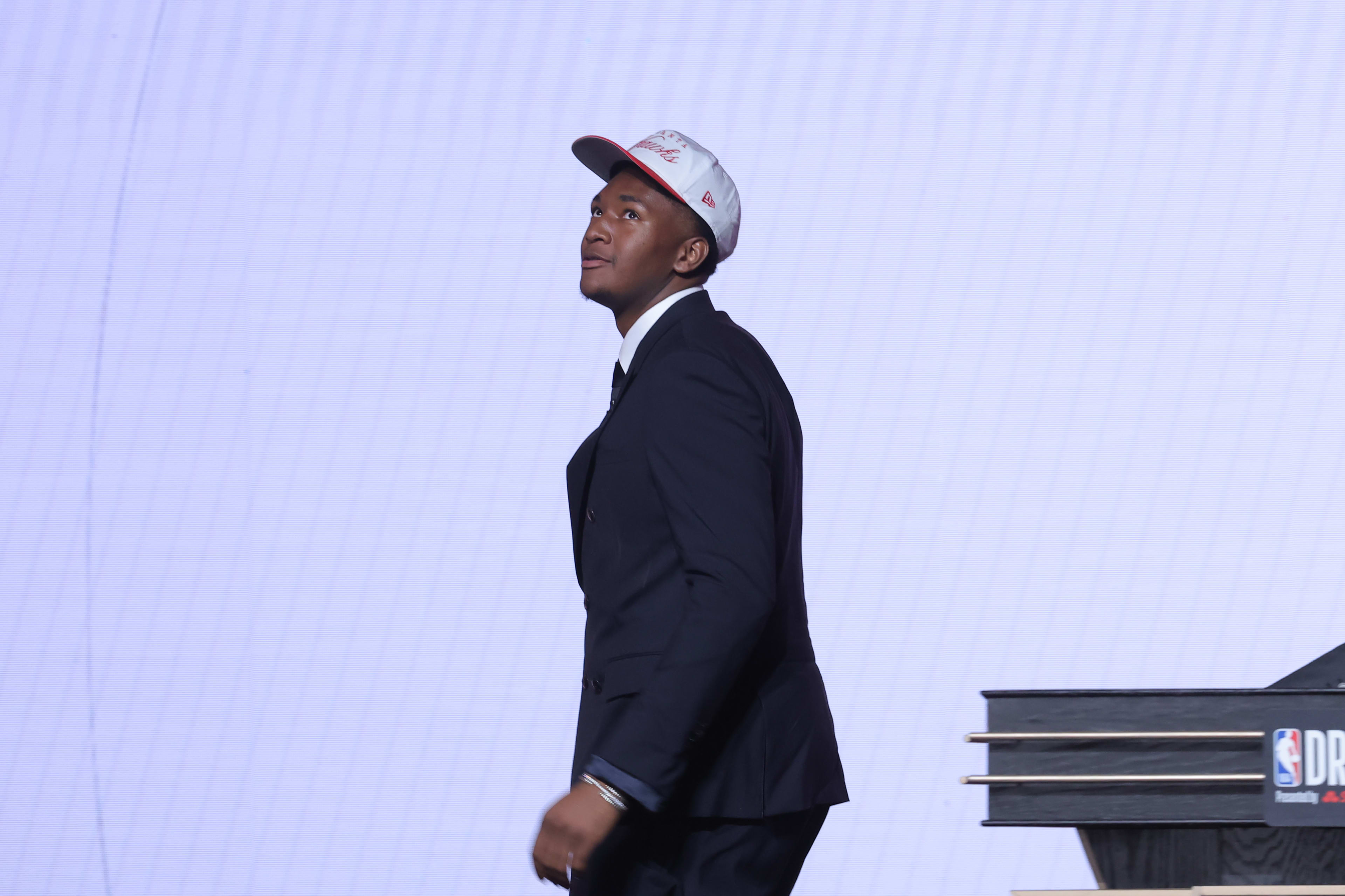 Jun 25, 2025; Brooklyn, NY, USA; Derik Queen reacts on stage after being selected as the 13th pick by the Atlanta Hawks in the first round of the 2025 NBA Draft at Barclays Center.