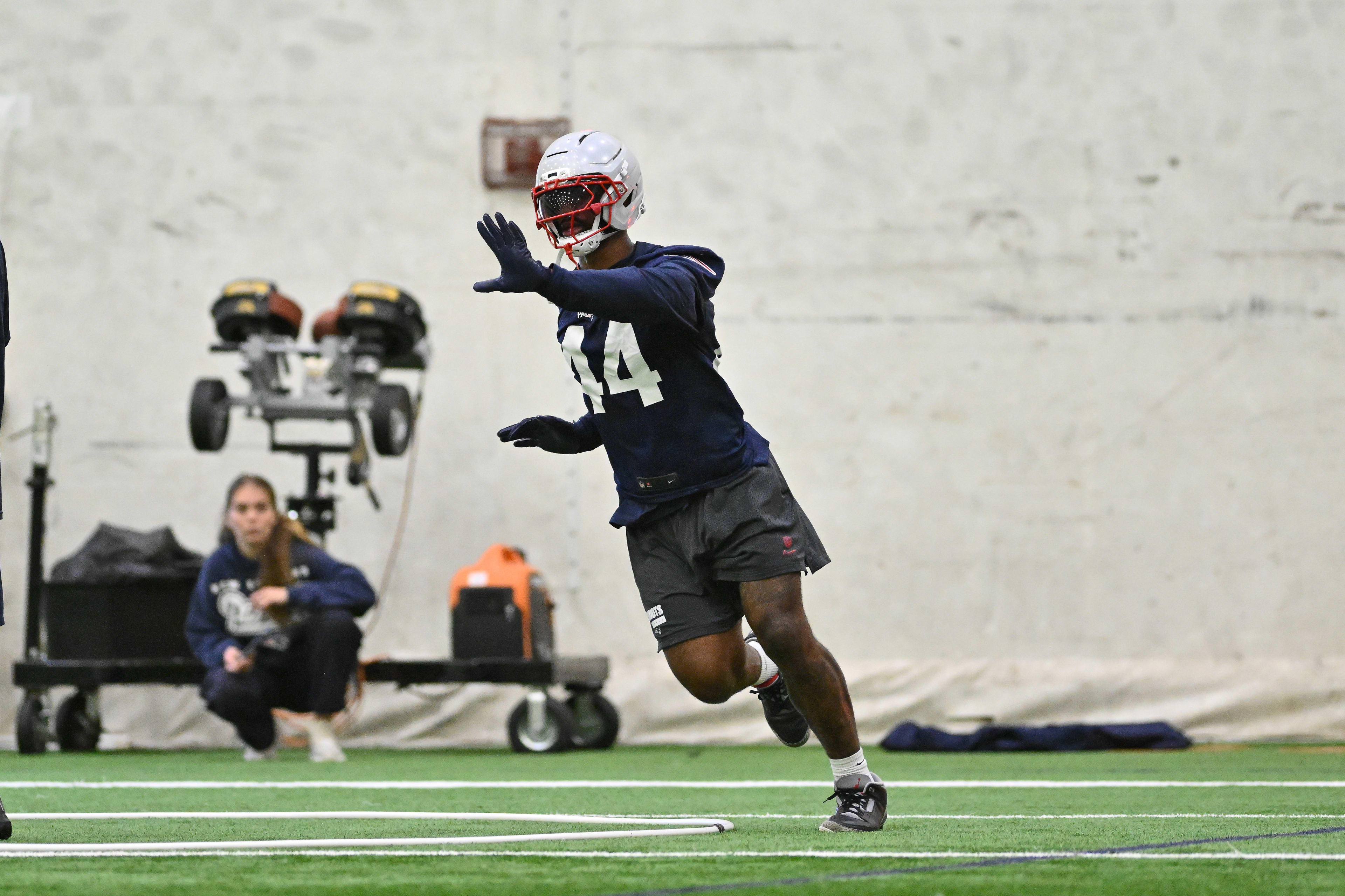 New England Patriots linebacker K'Lavon Chaisson (44) runs through a drill during minicamp held in the WIN Field House at Gillette Stadium.