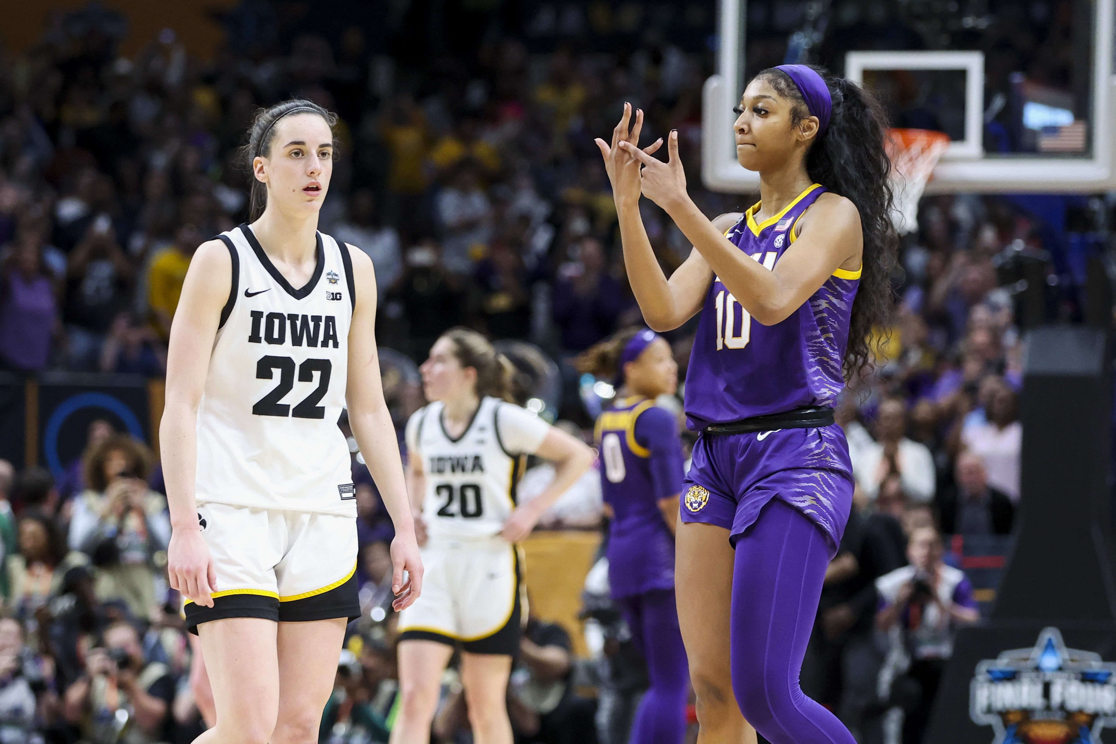 Former LSU Lady Tigers forward Angel Reese (10) and former Iowa Hawkeyes guard Caitlin Clark (22)