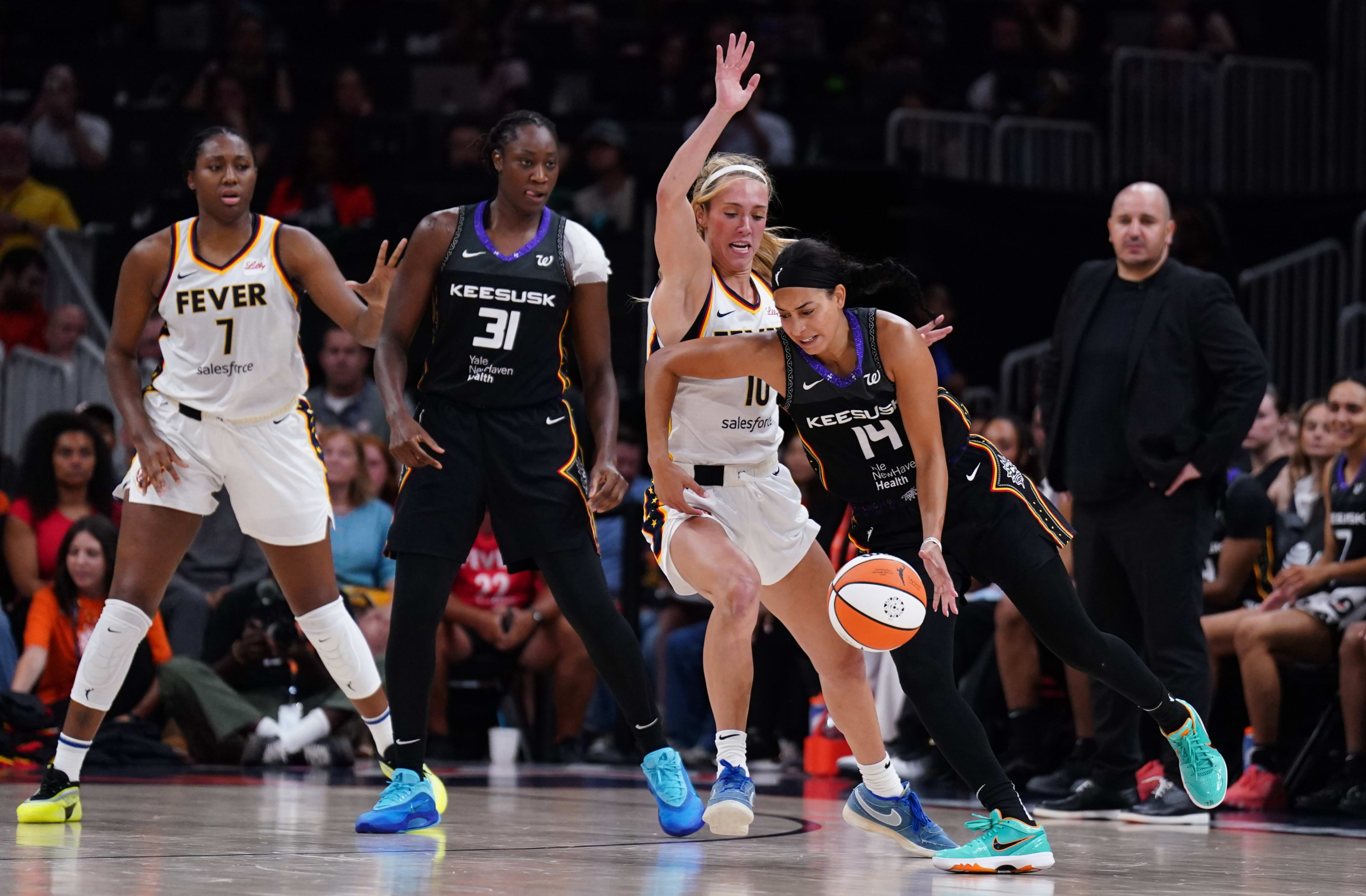 Connecticut Sun guard Bria Hartley drives the ball against Indiana Fever guard Lexie Hull